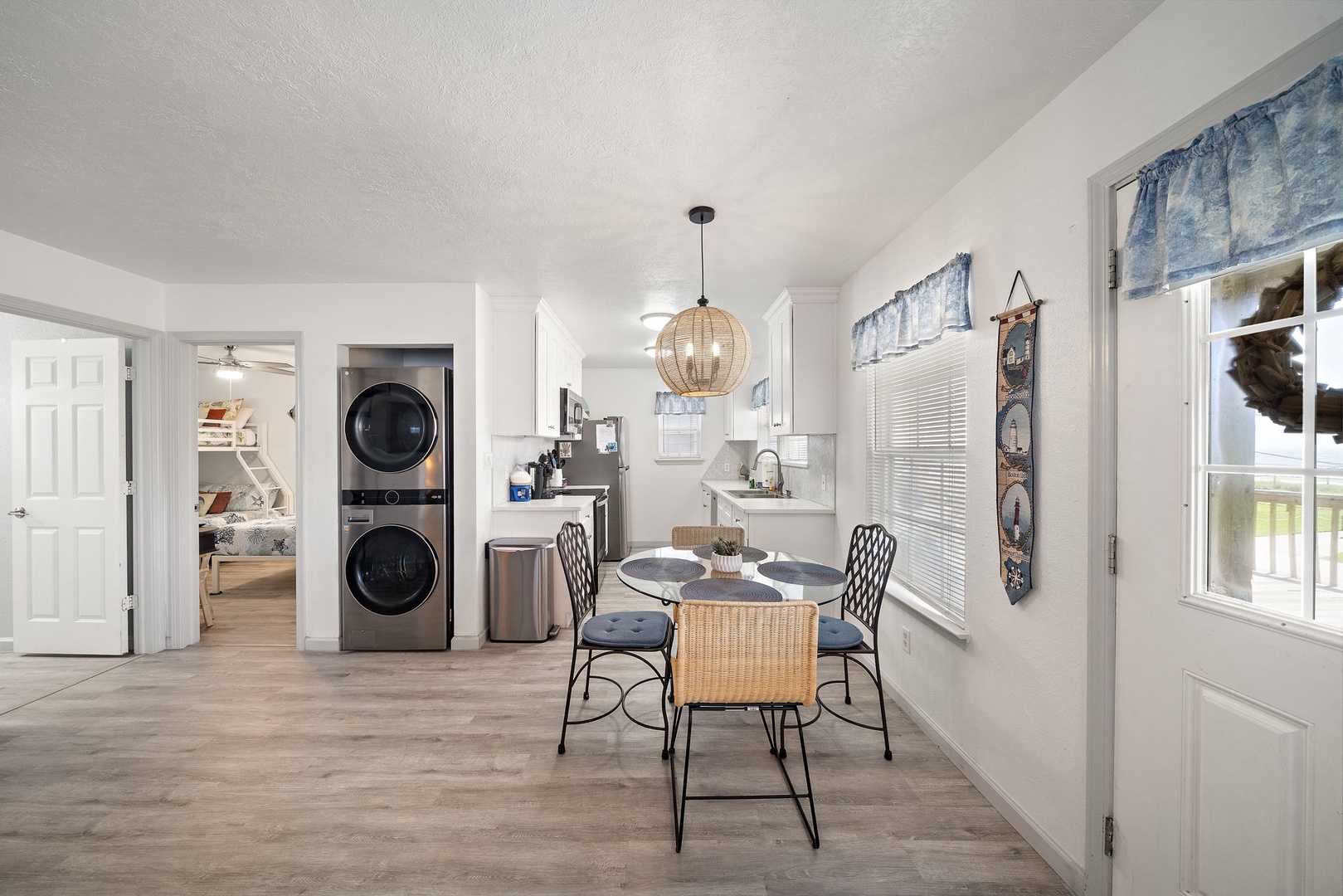 You'll love preparing meals in the well-equipped kitchen while natural light streams through the windows, creating the perfect atmosphere for memorable meals.