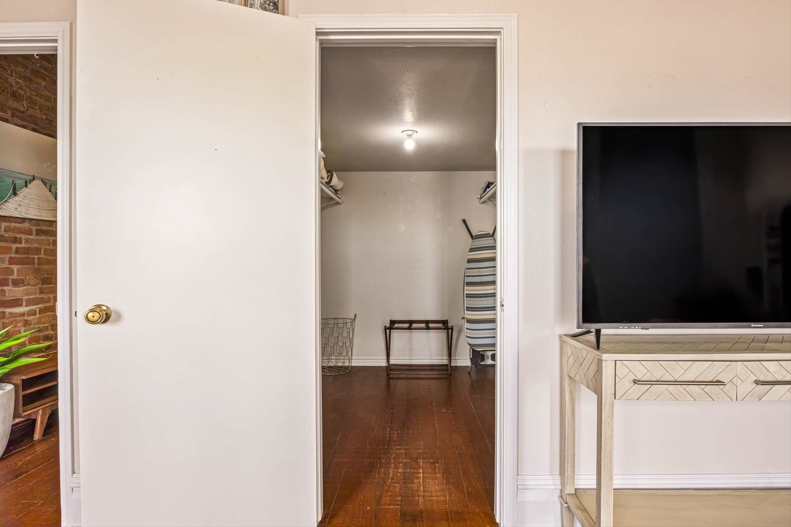 Closet with shelves and rods to keep belongings neat.