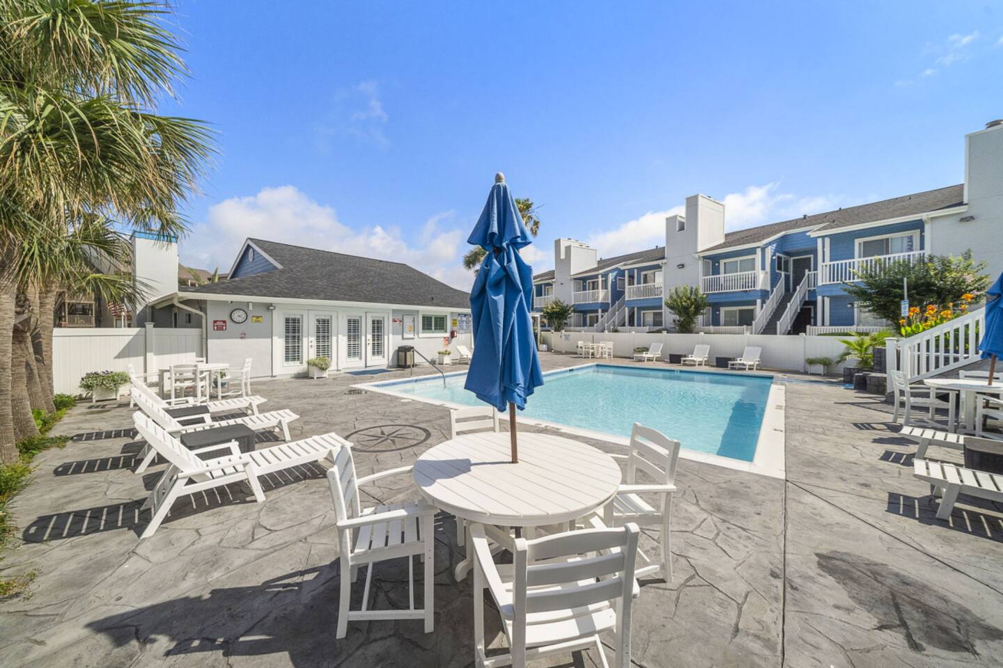 Resort-style shared pool with coastal charm.