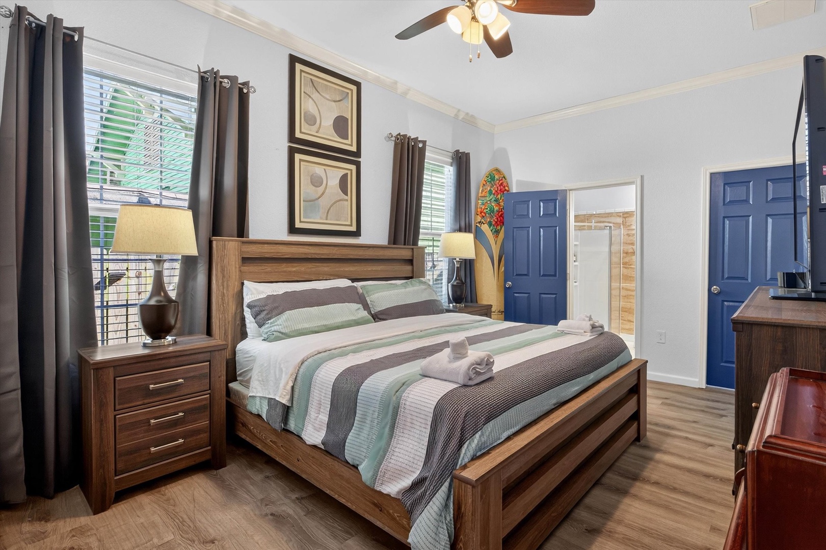 Sink into your comfortable bedroom retreat with cozy bedding and warm wood furnishings for the perfect night's rest. Ensuite bathroom attached.