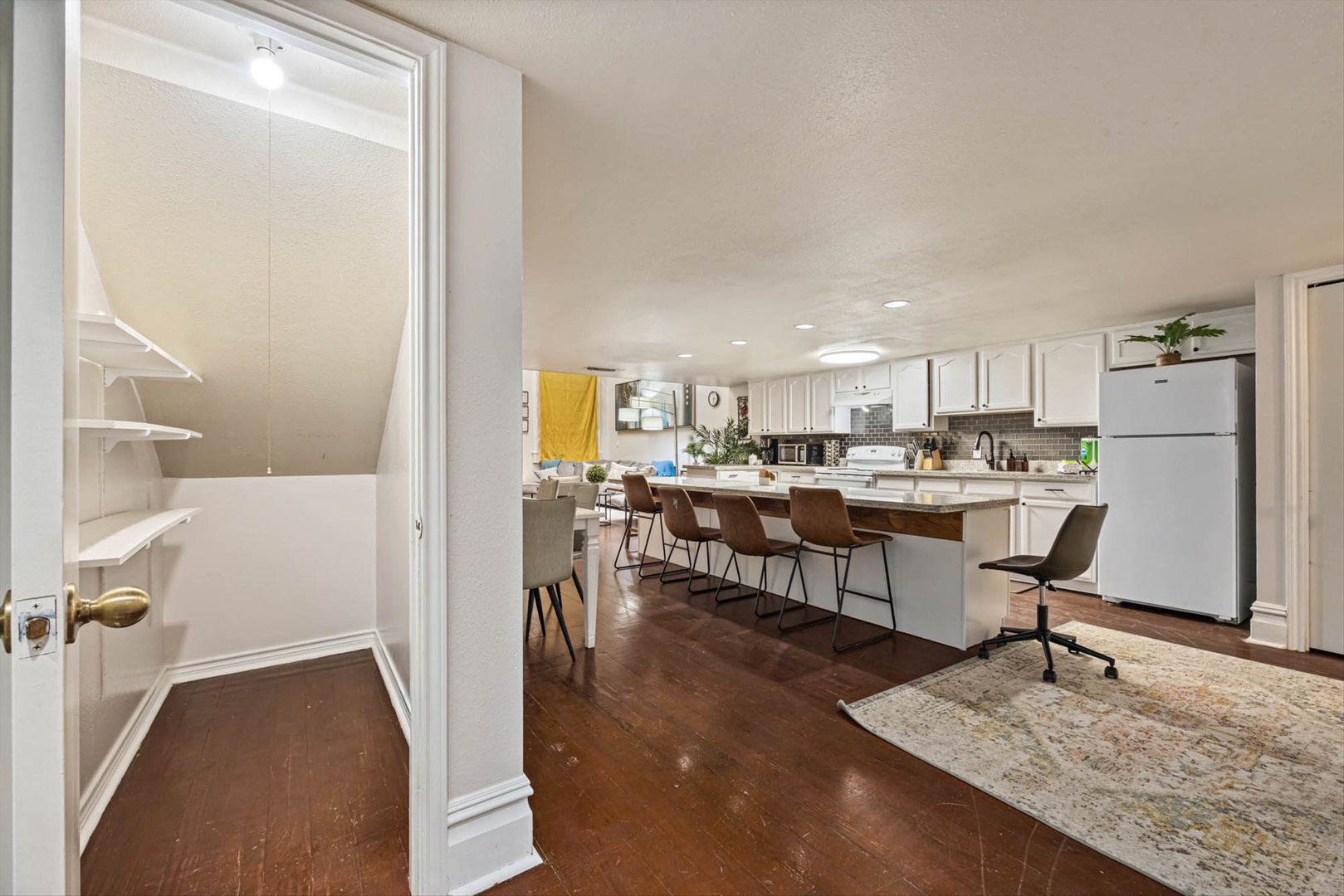 Spacious modern kitchen with island and bar seating.
