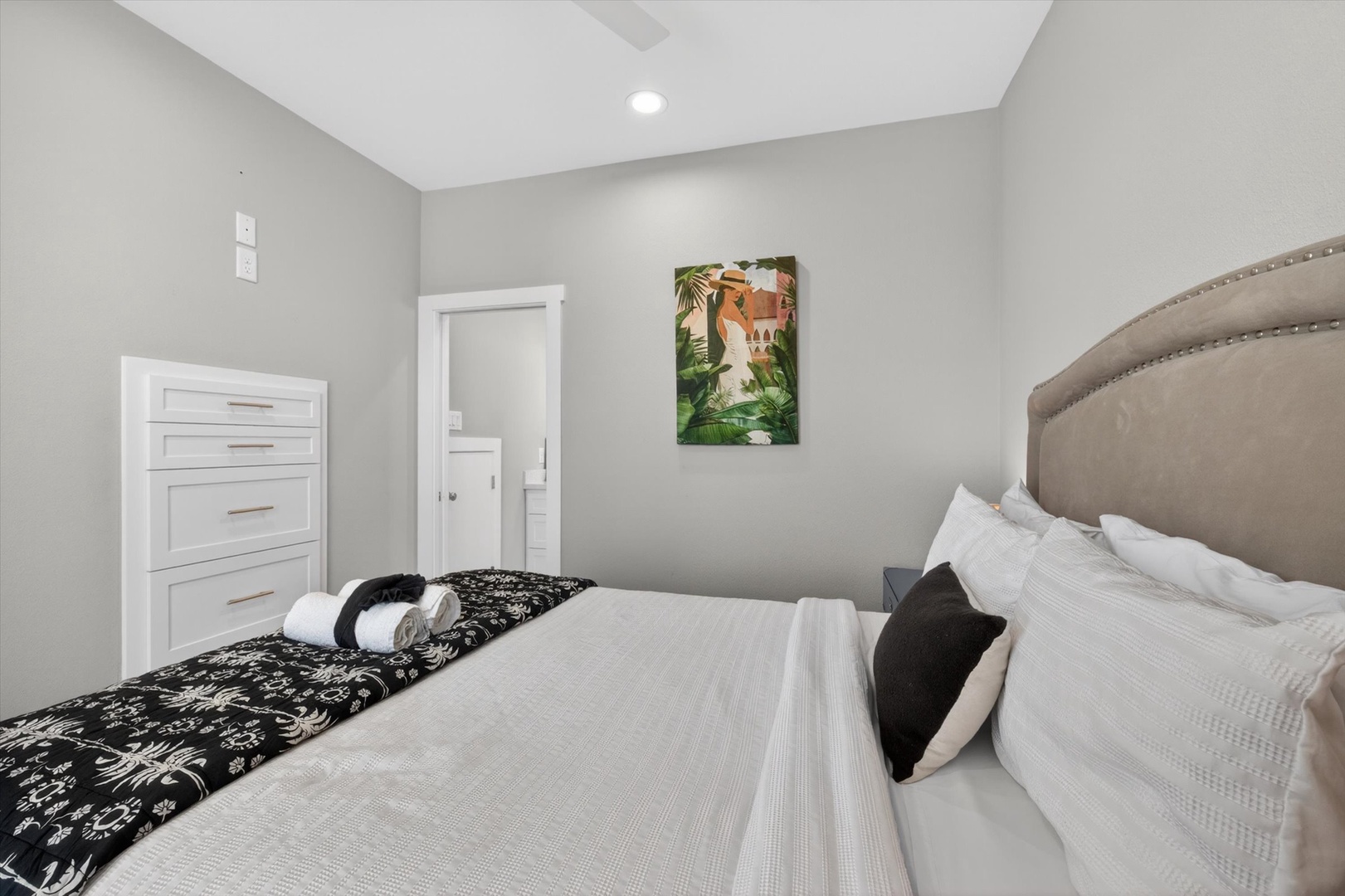 Relax in a serene bedroom with crisp linens.