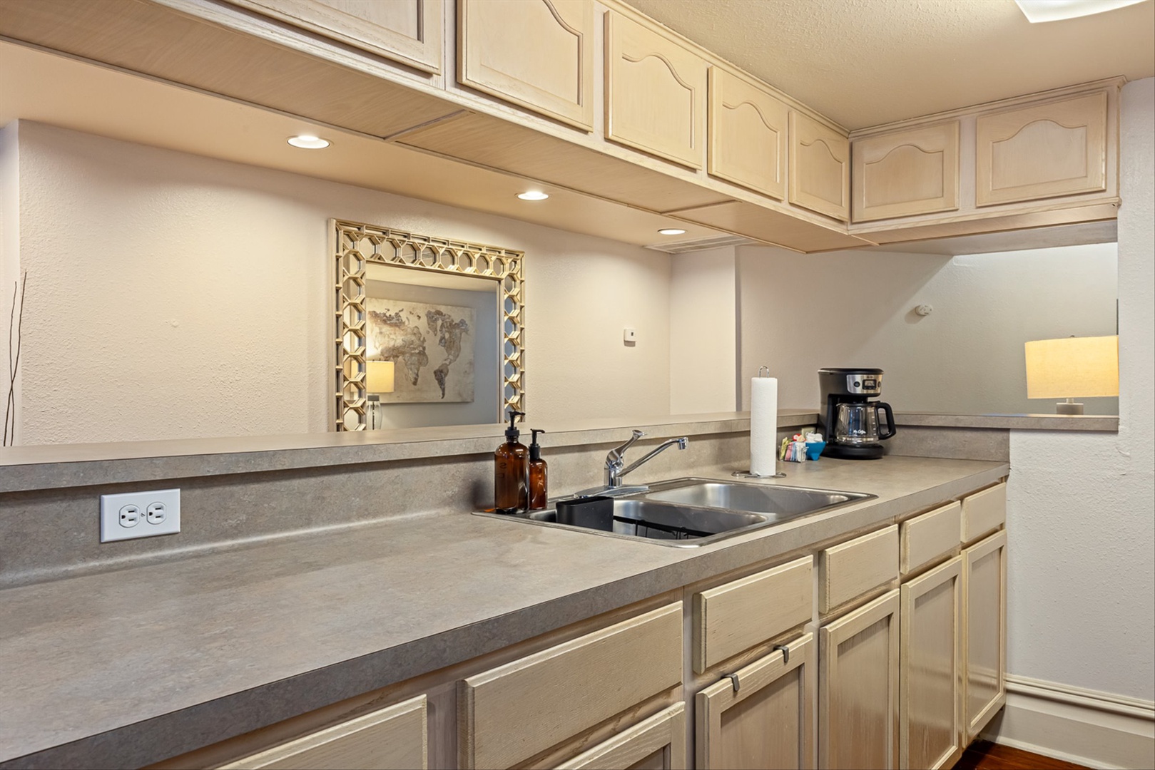 Spacious counter and sink area for meals and coffee.