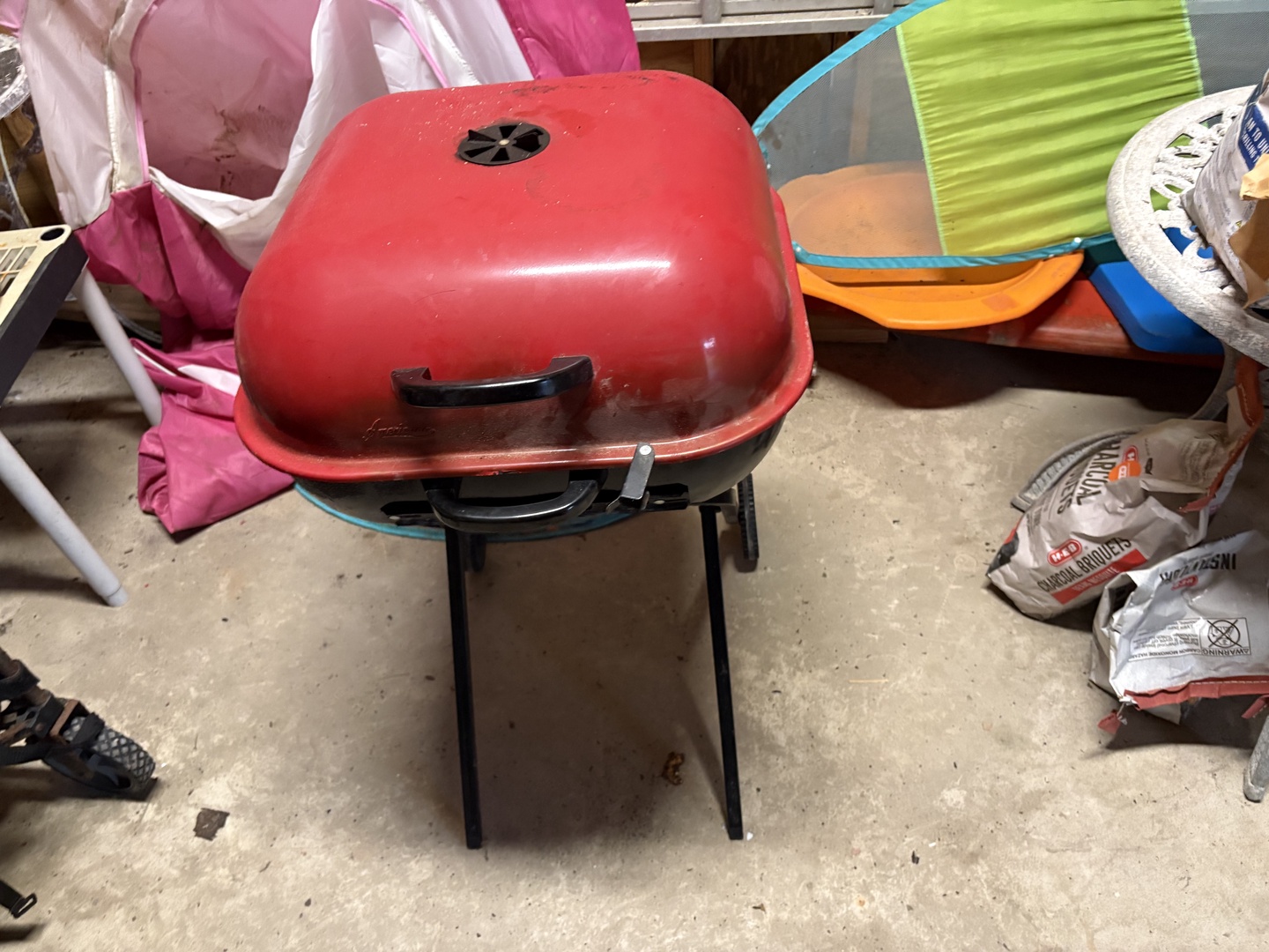 A portable charcoal grill ready for outdoor cookouts, there is also a gas grill if you prefer cooking with gas.