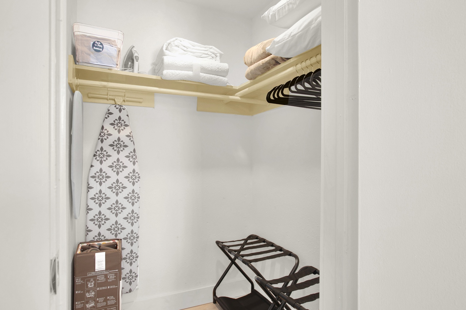 Closet stocked with linens and travel comforts