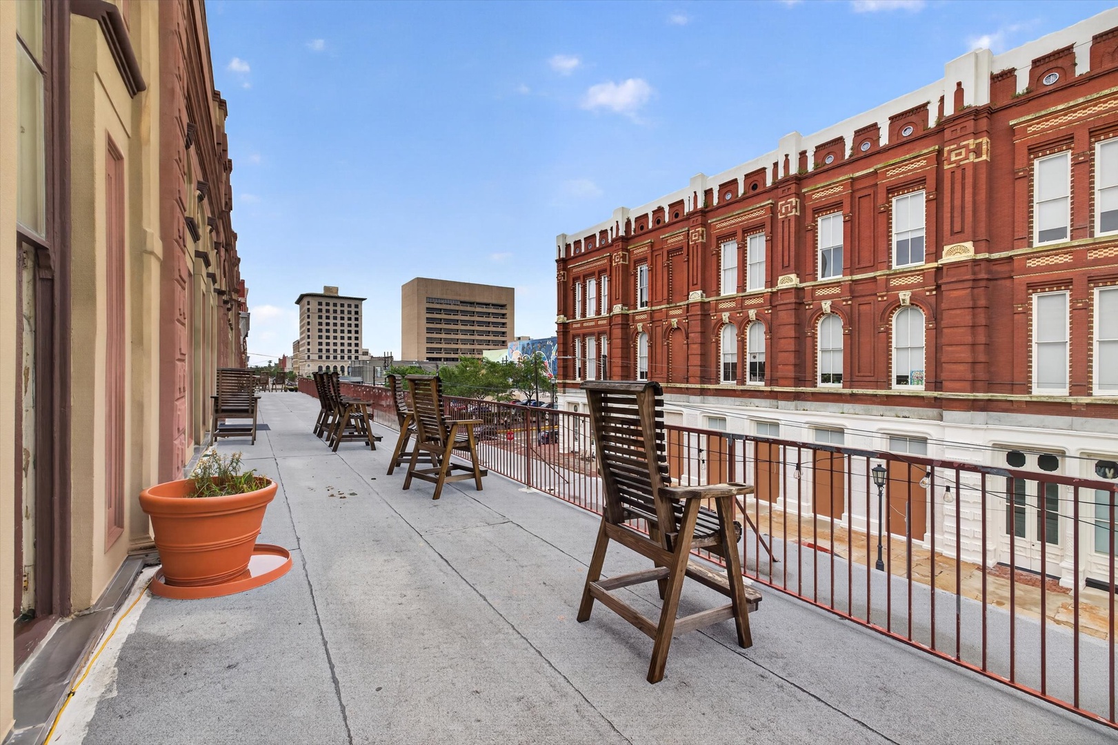 Balcony overlooking historic downtown with city views.
