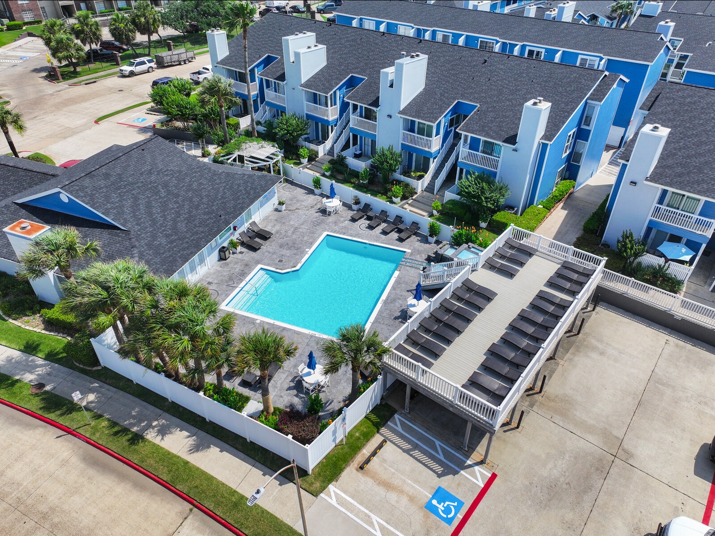 Resort-style pool with tropical landscaping