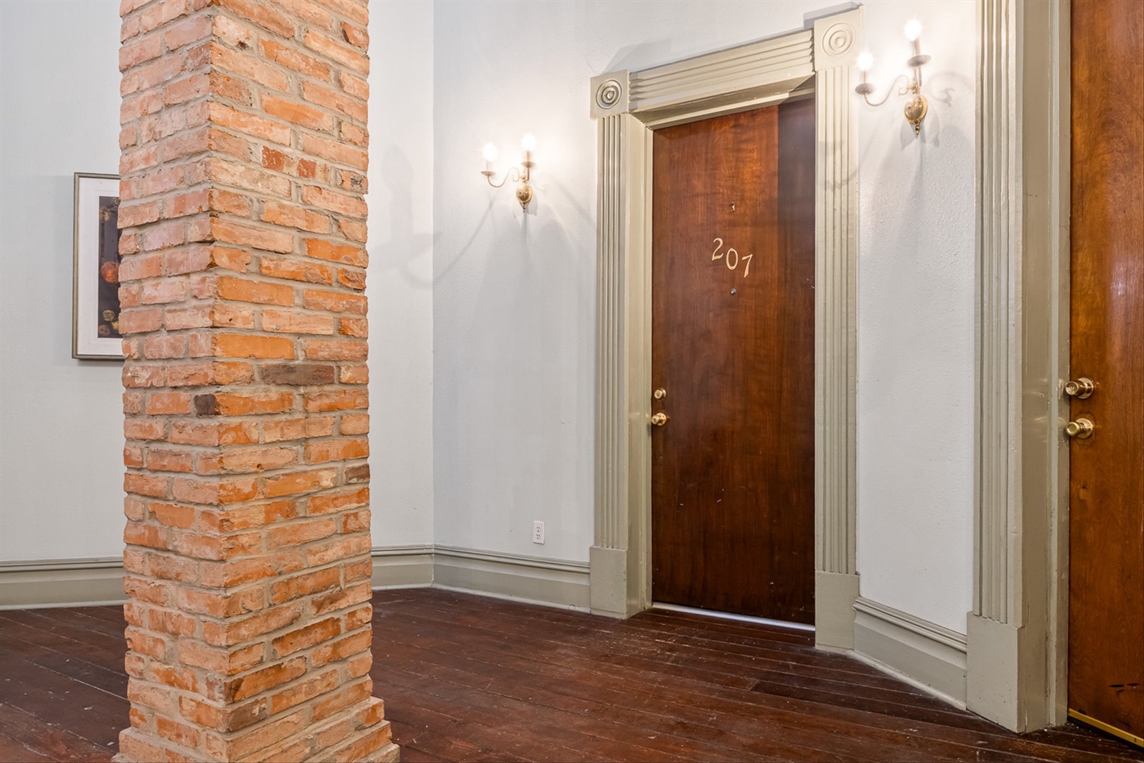 Classic brick corridors lead to a stylish, welcoming interior.