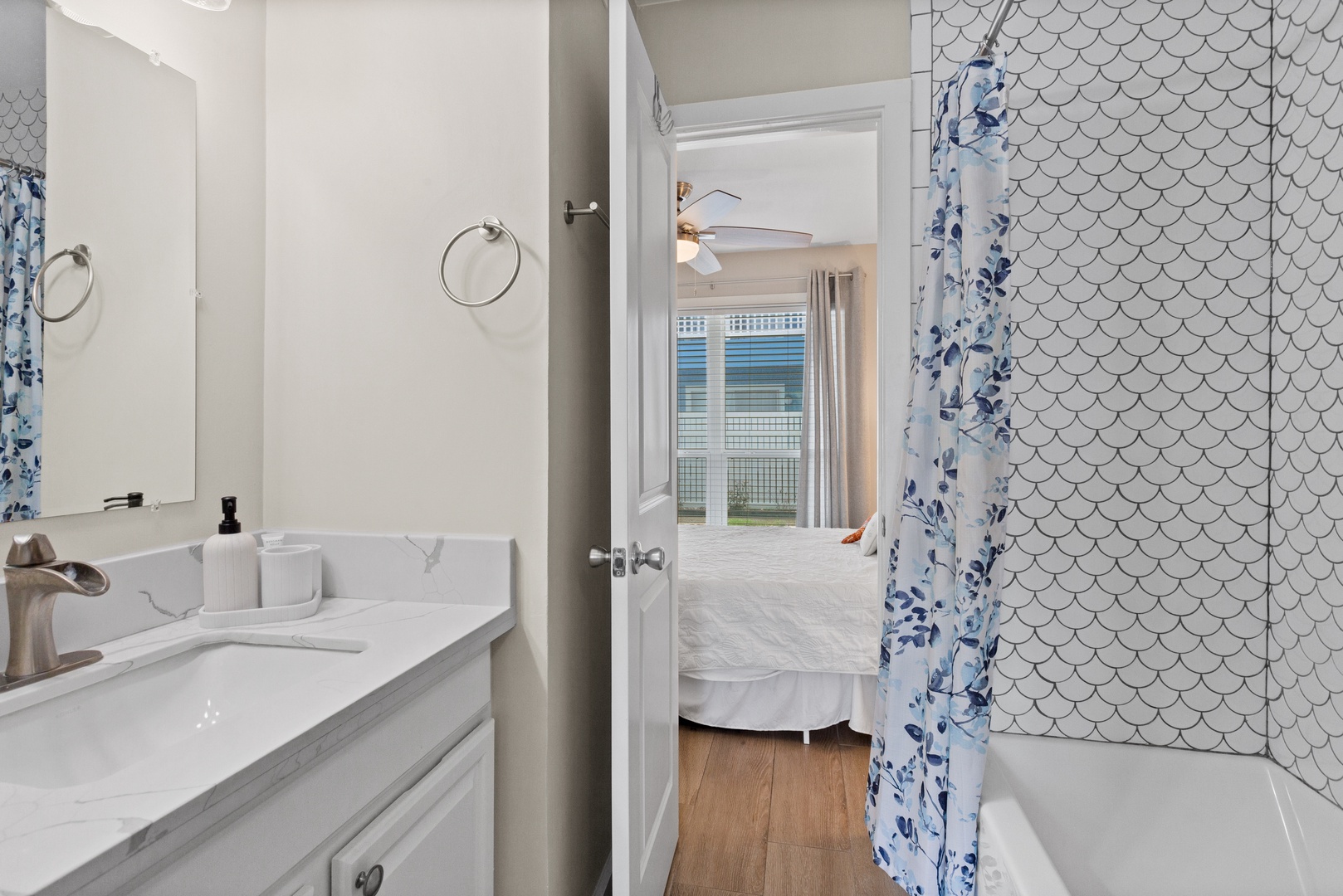 Scalloped tile shower with modern coastal style