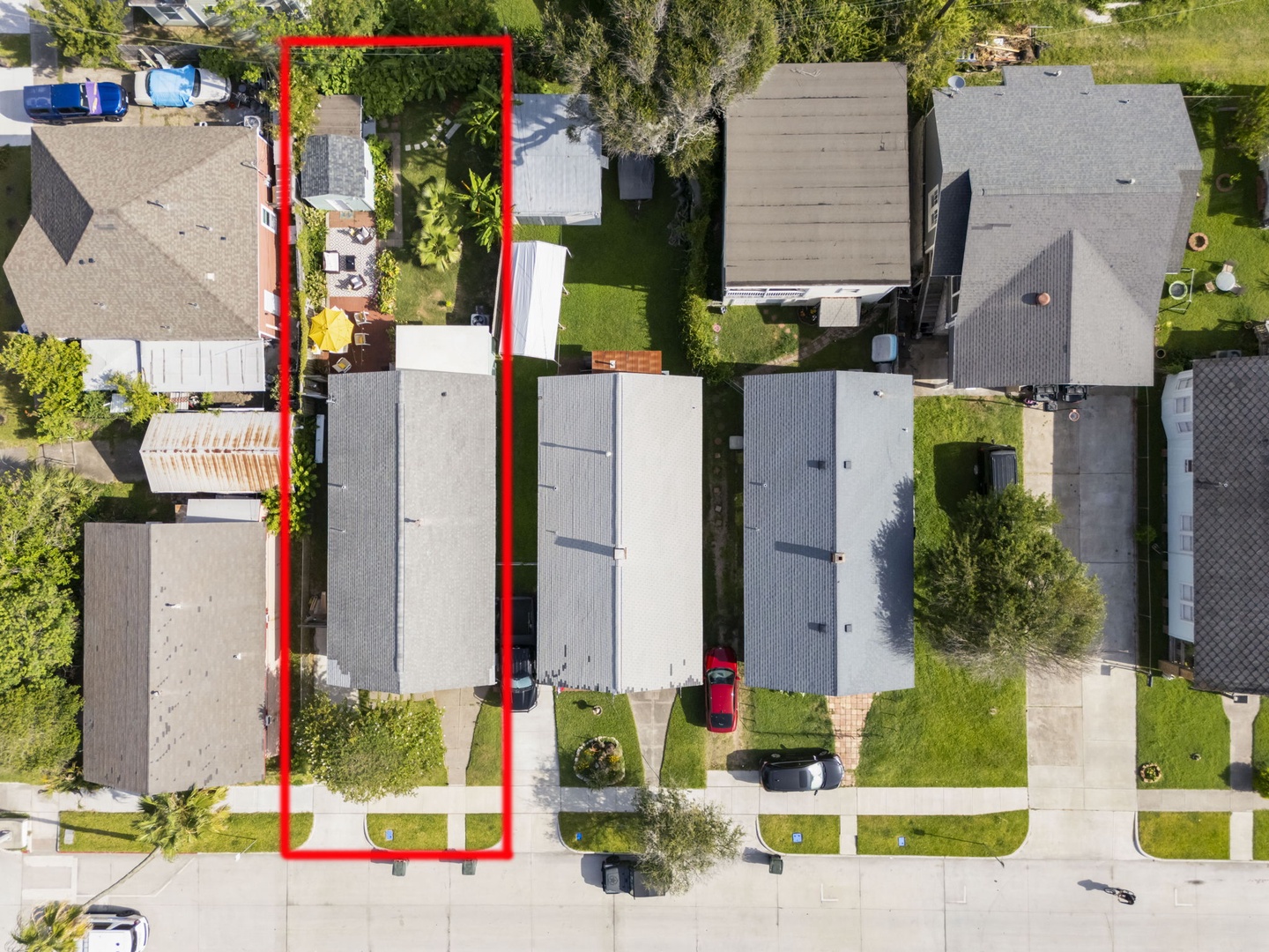 Property highlighted in aerial neighborhood view.