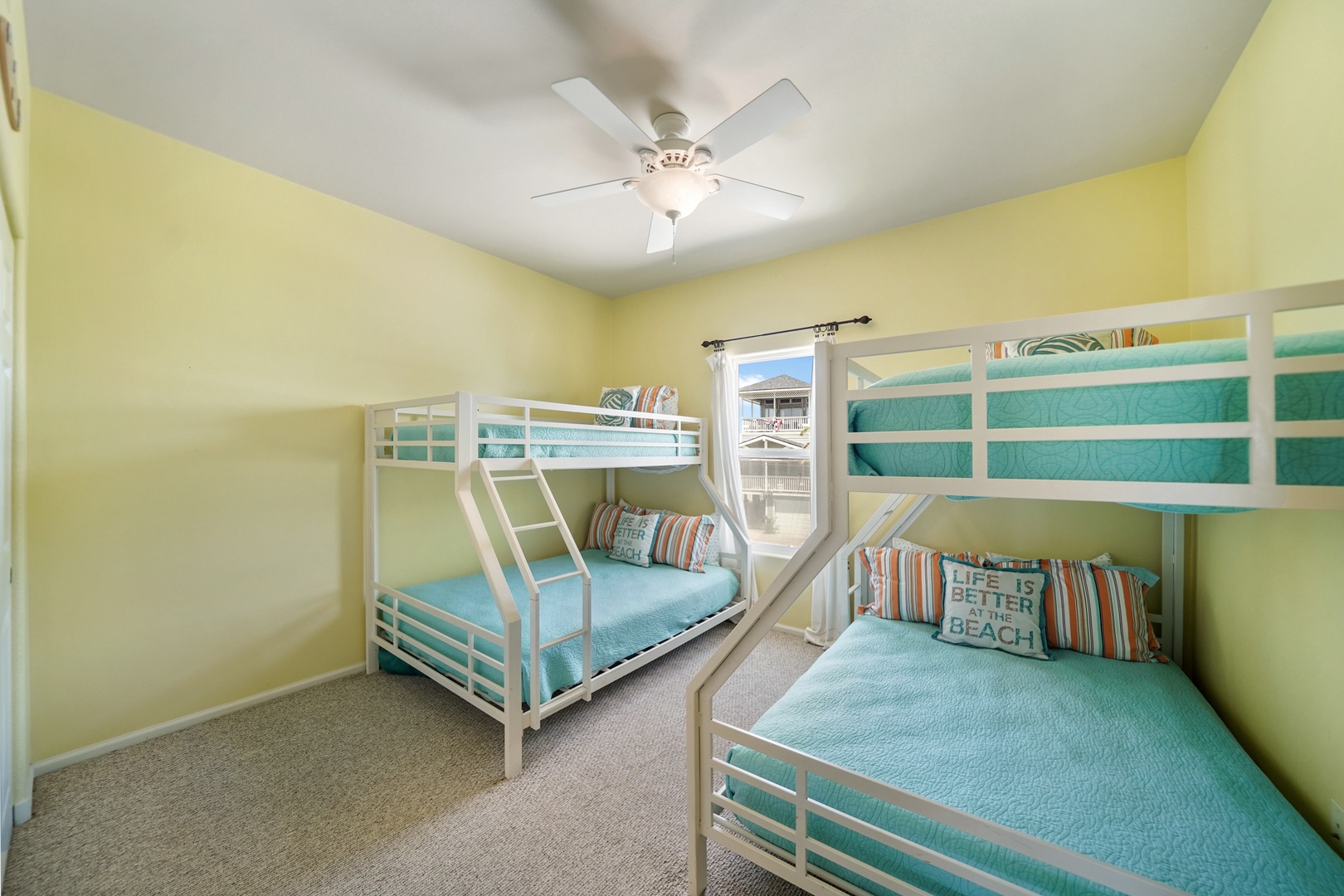 Coastal bunk room with bright natural light