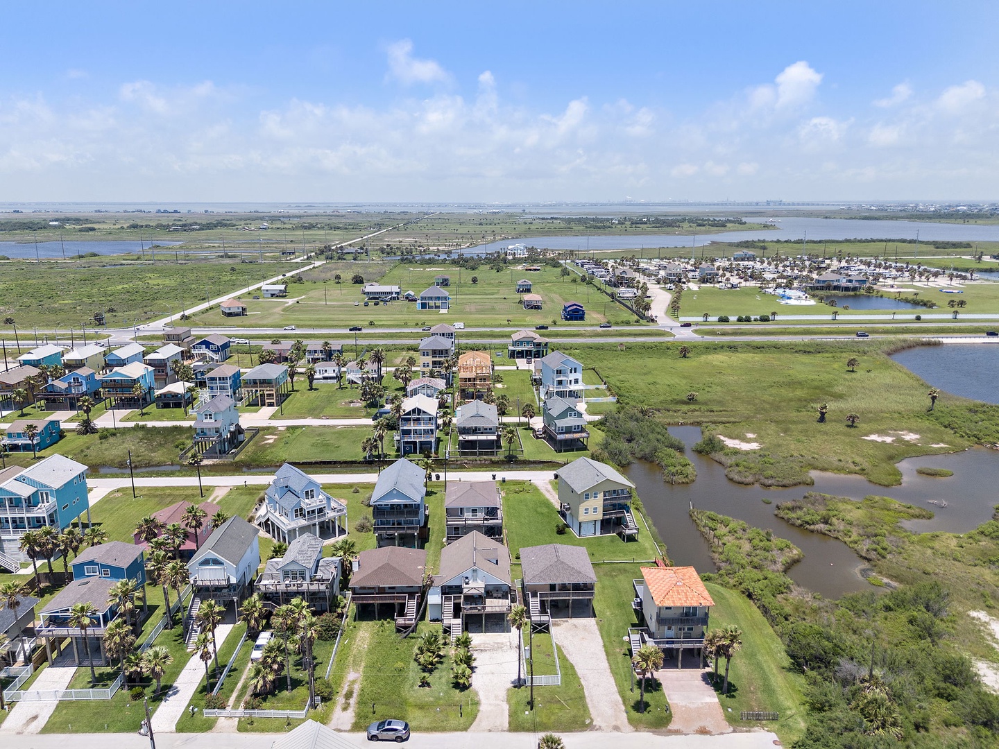 Discover your perfect coastal escape in this charming waterfront community! Your vacation home awaits among colorful beach houses with stunning water views and endless blue skies.