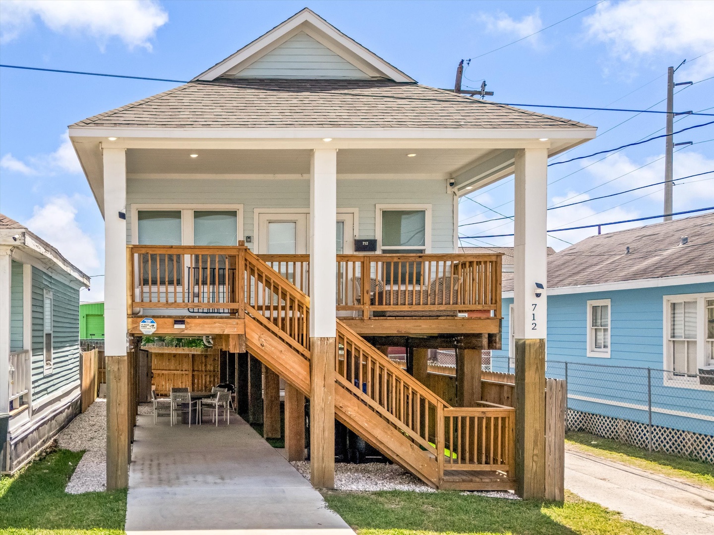 Elevated beach cottage with covered porch and stairs