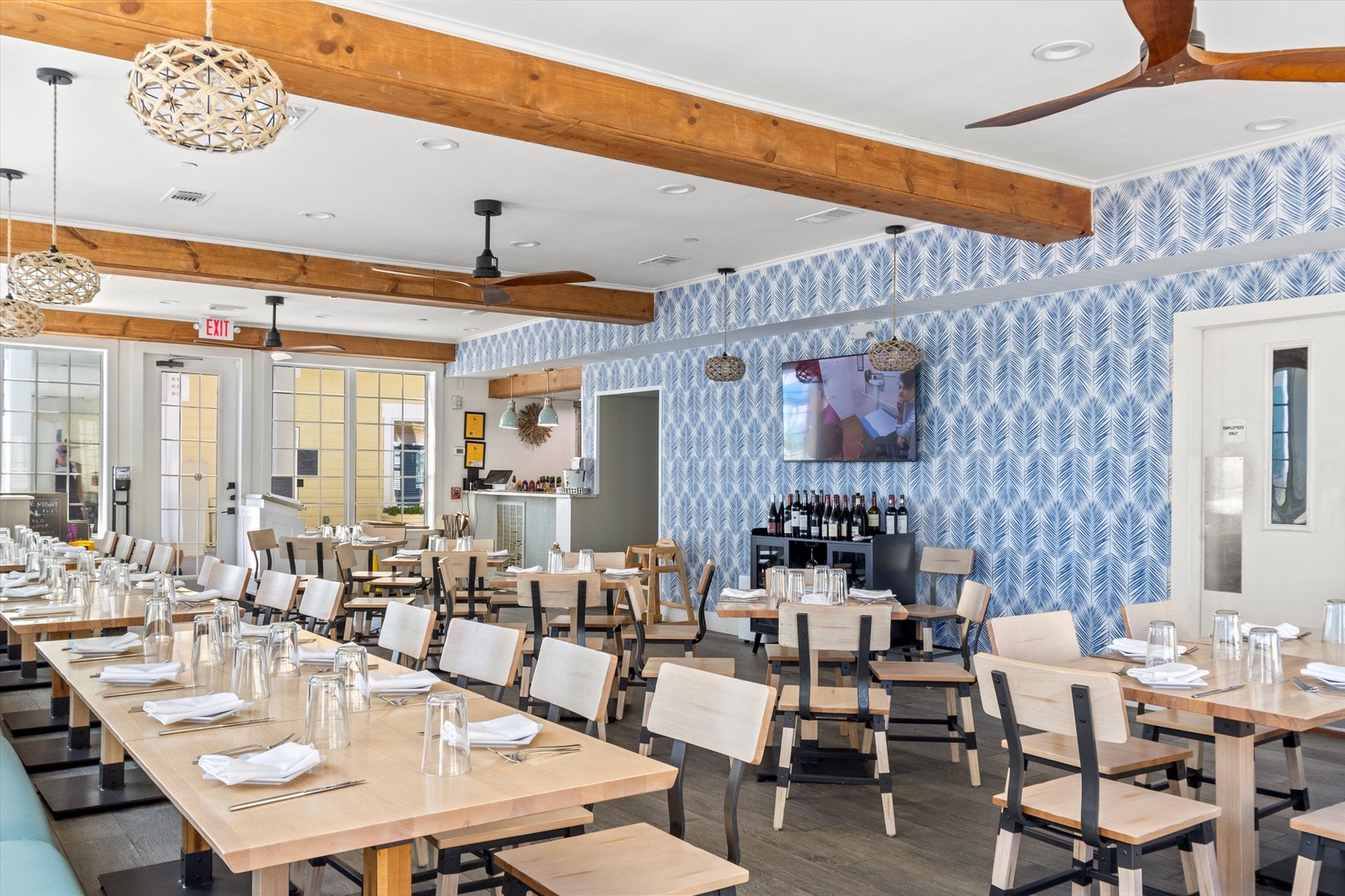 Resort dining area with exposed beams and modern décor.