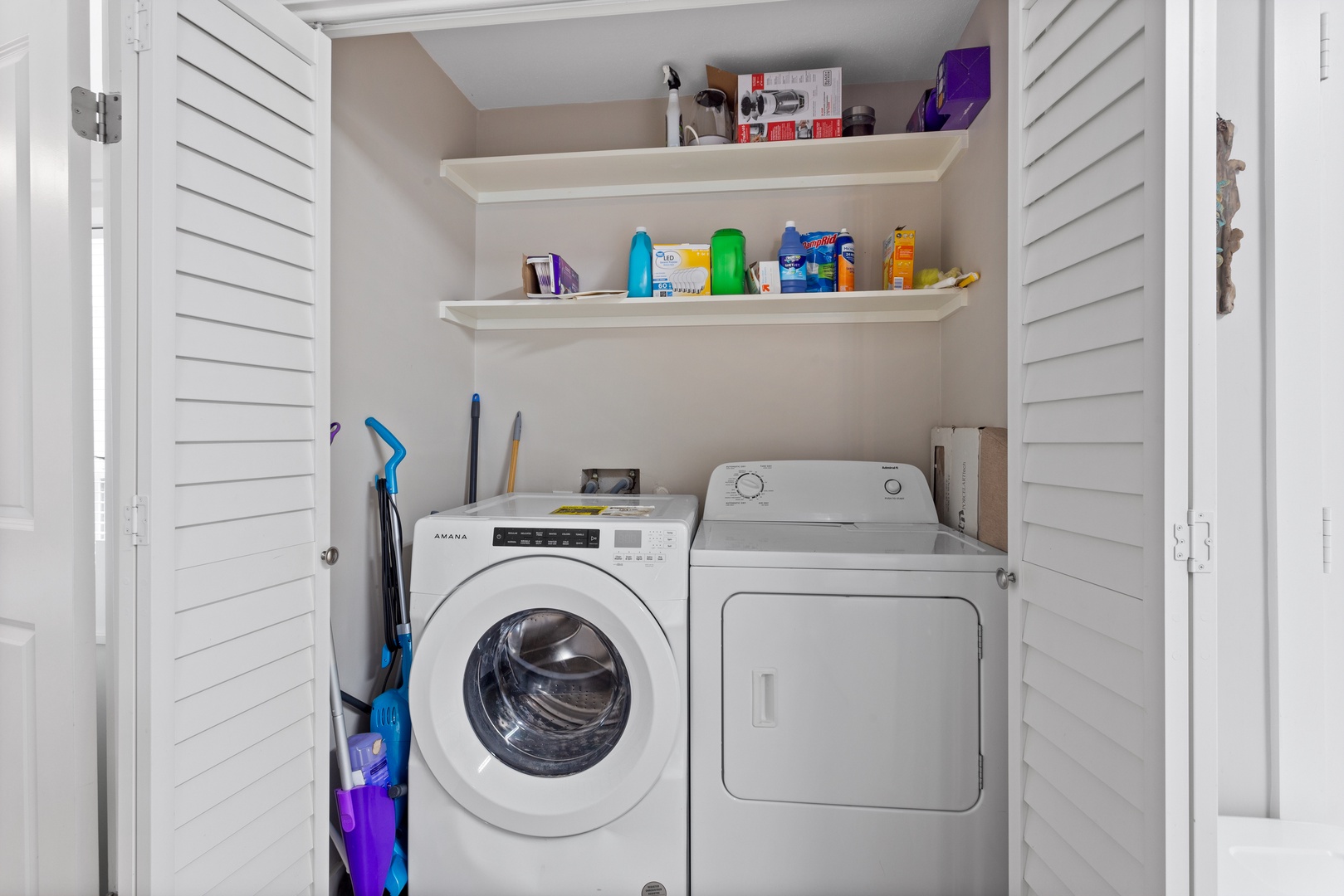 Private laundry with storage shelving