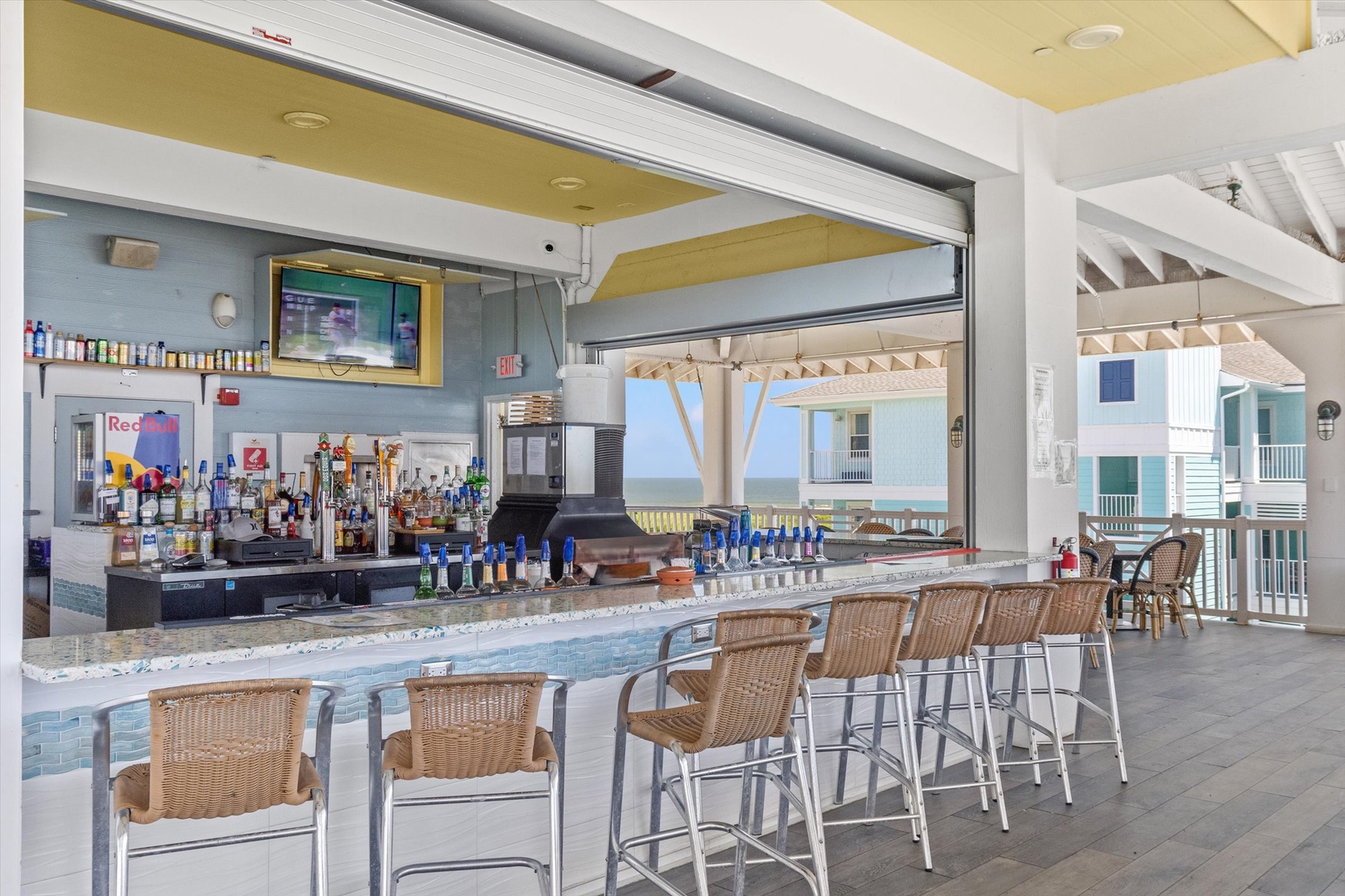 Oceanfront bar with drinks and endless sea views.