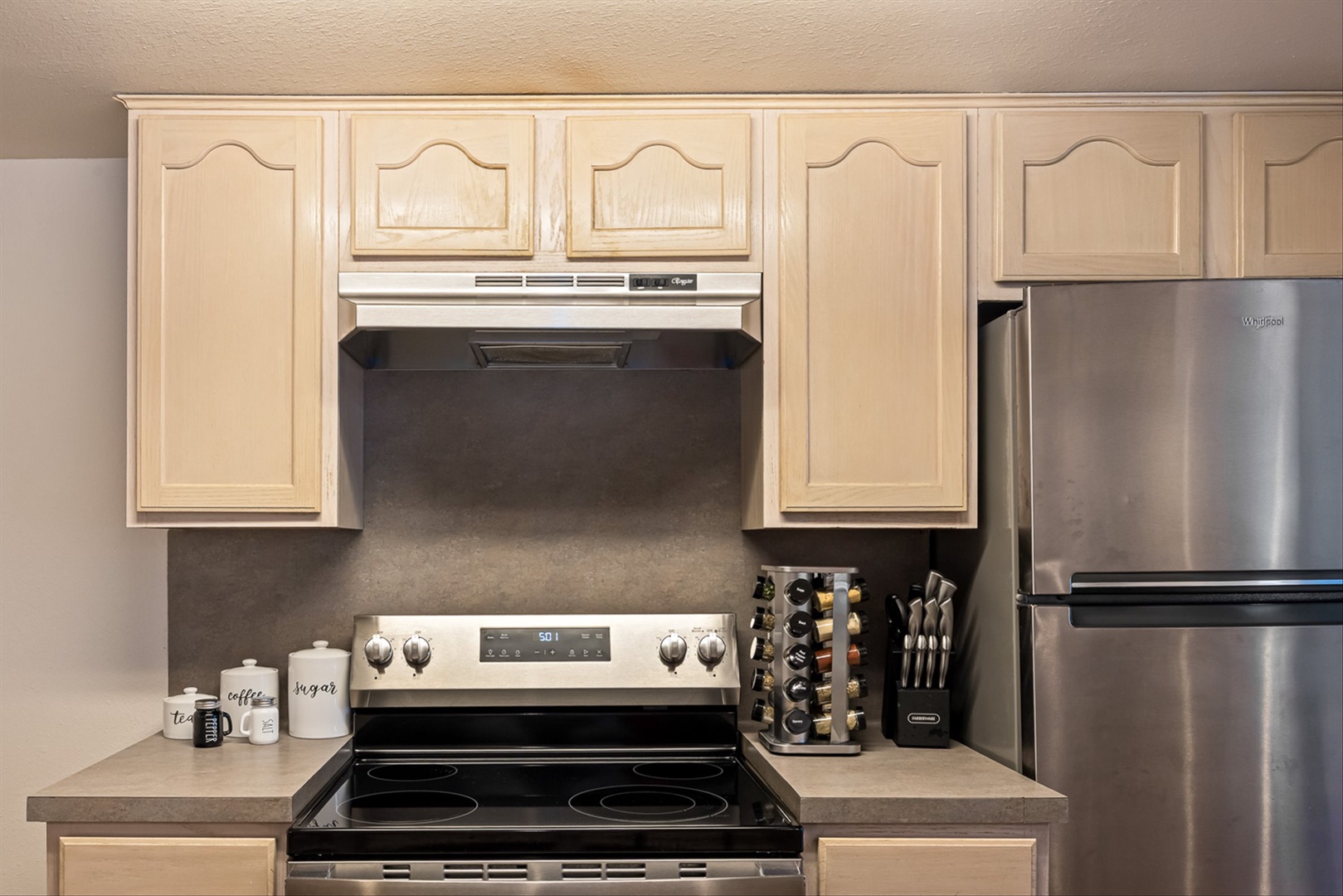 Sleek stainless steel stove and appliances for modern kitchen.