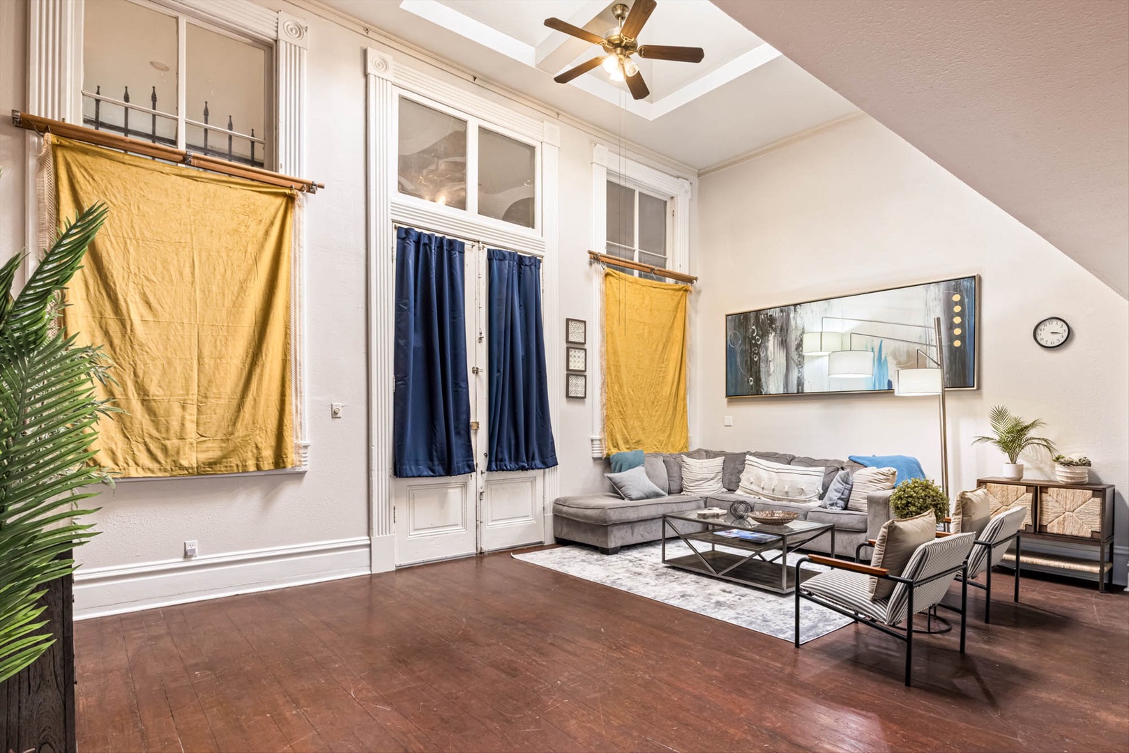 Living area with stylish furnishings, soaring ceilings, and accents.