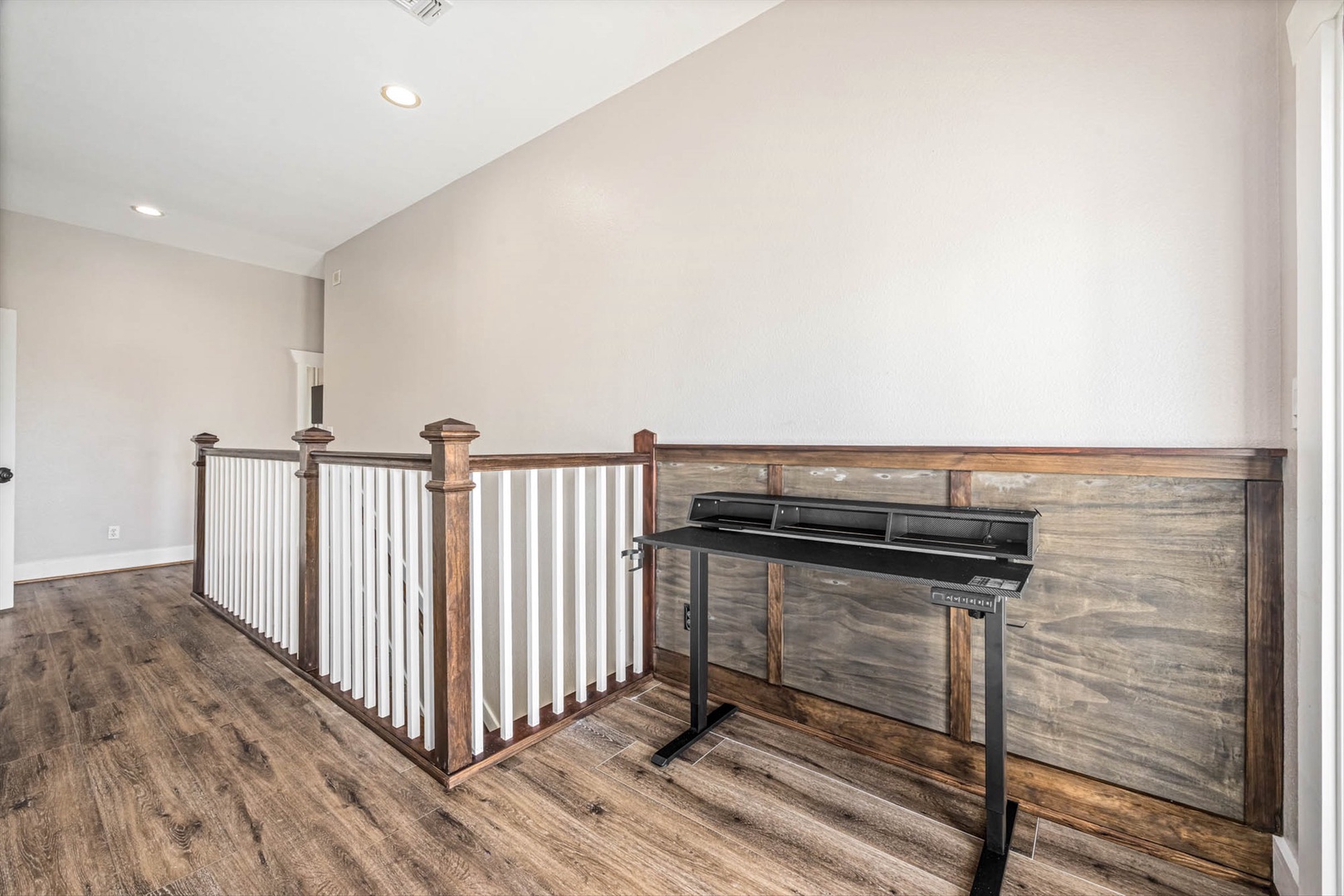 Upstairs workspace with rustic wood accents and modern amenities.