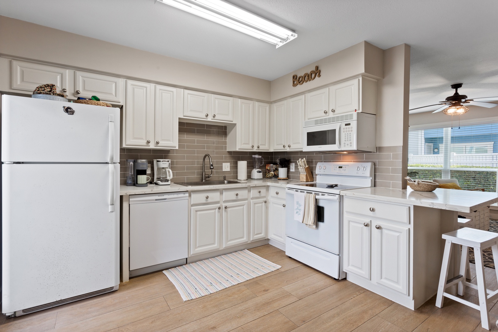 Fully equipped kitchen with coastal charm