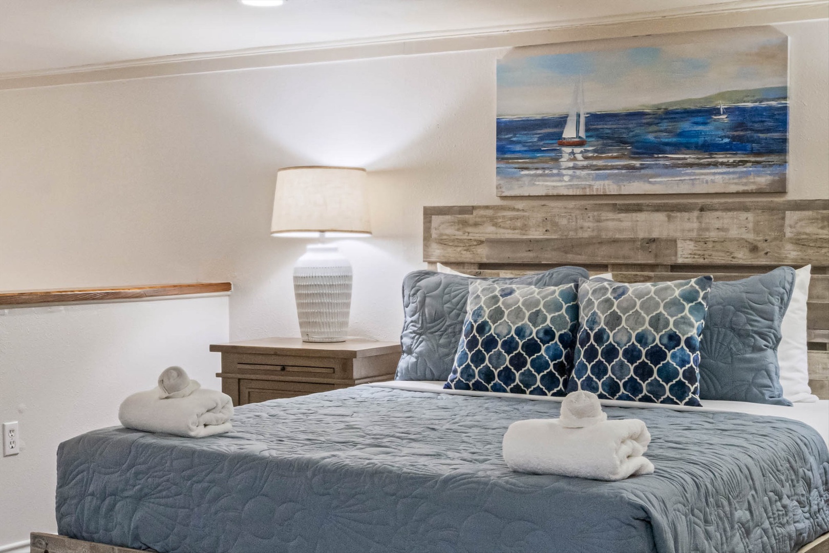 Ocean-inspired bedroom with crisp linens and welcoming decor.