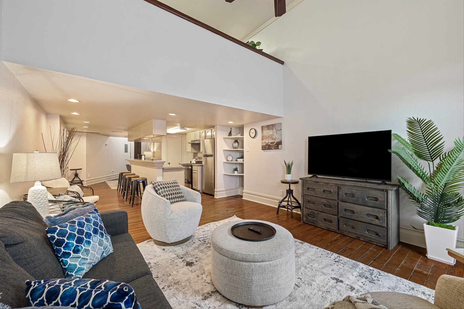 Relax in the open living area with kitchen and TV.