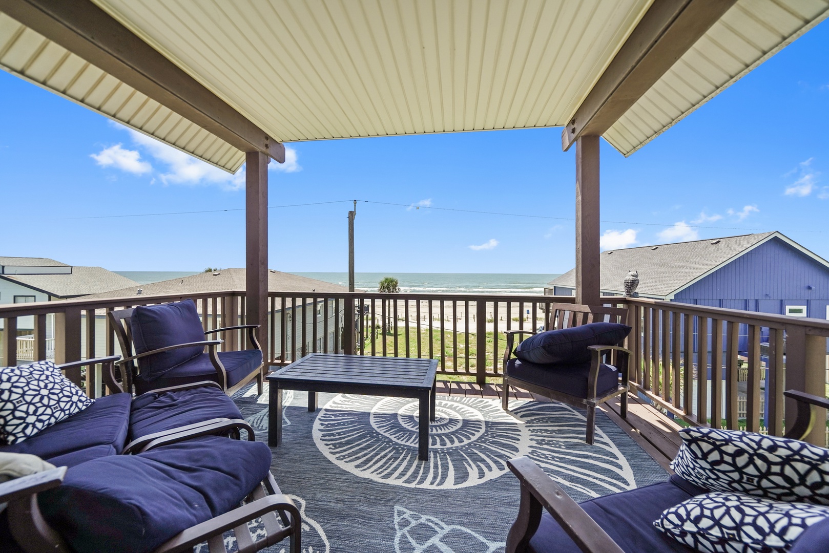 Ocean-view balcony with cushioned seating