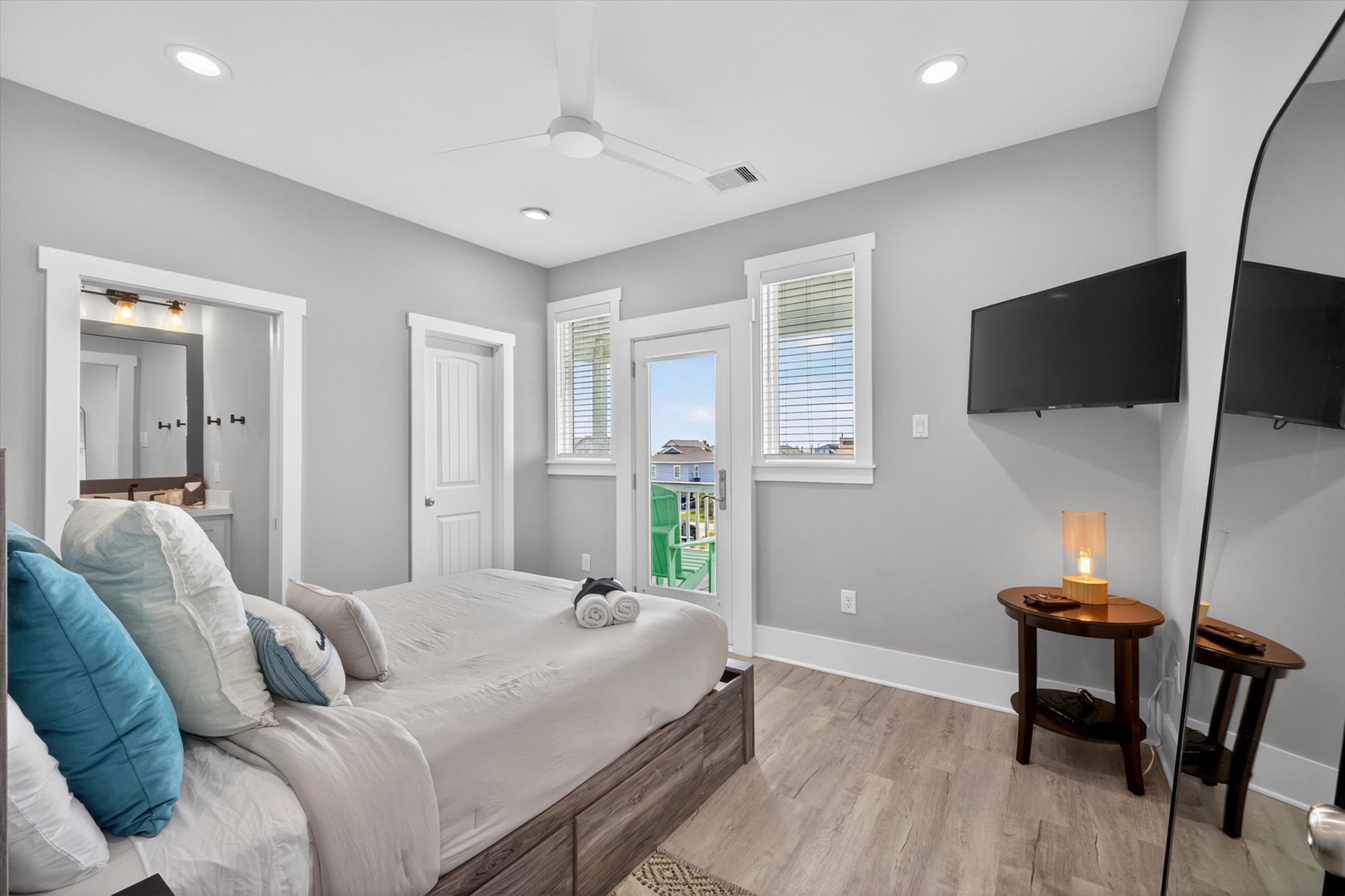 Calming bedroom retreat with colorful neighborhood views.