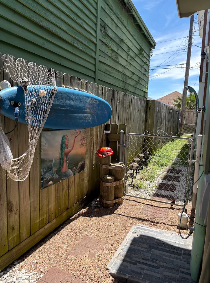 Outdoor shower located on the side of the house.