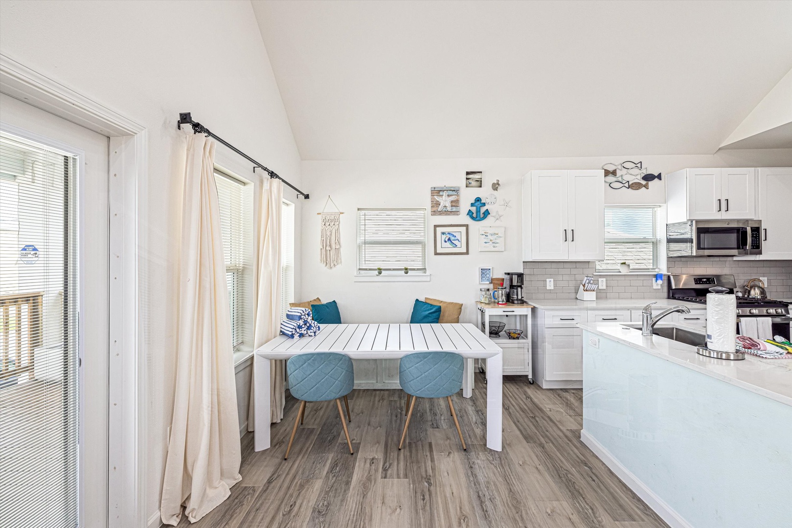 Gather for meals in a bright coastal dining space.