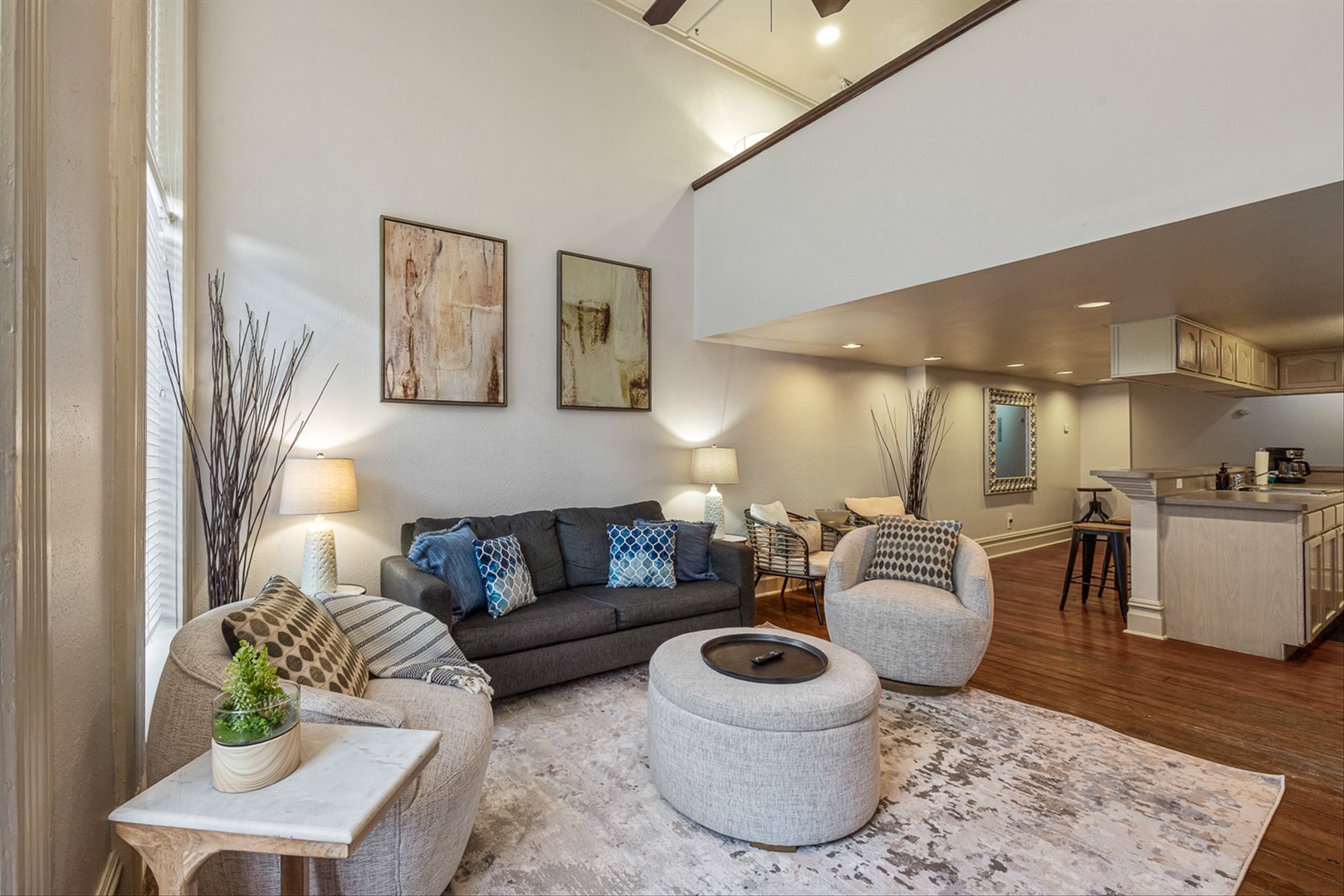 Stylish living space with comfy seating and pullout bed.