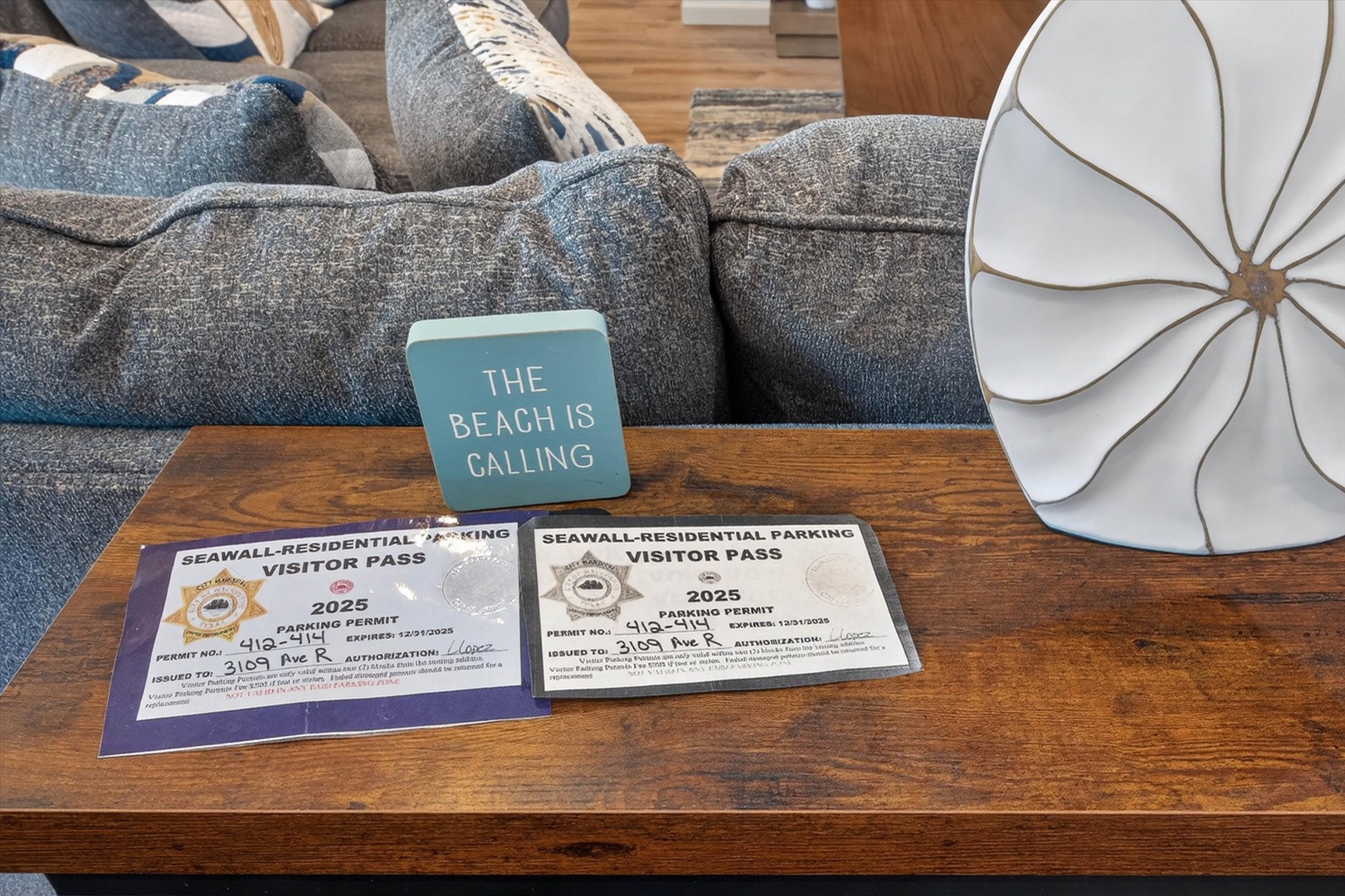 Your parking passes await on the coffee table - beach adventures are just steps away from your cozy living space.