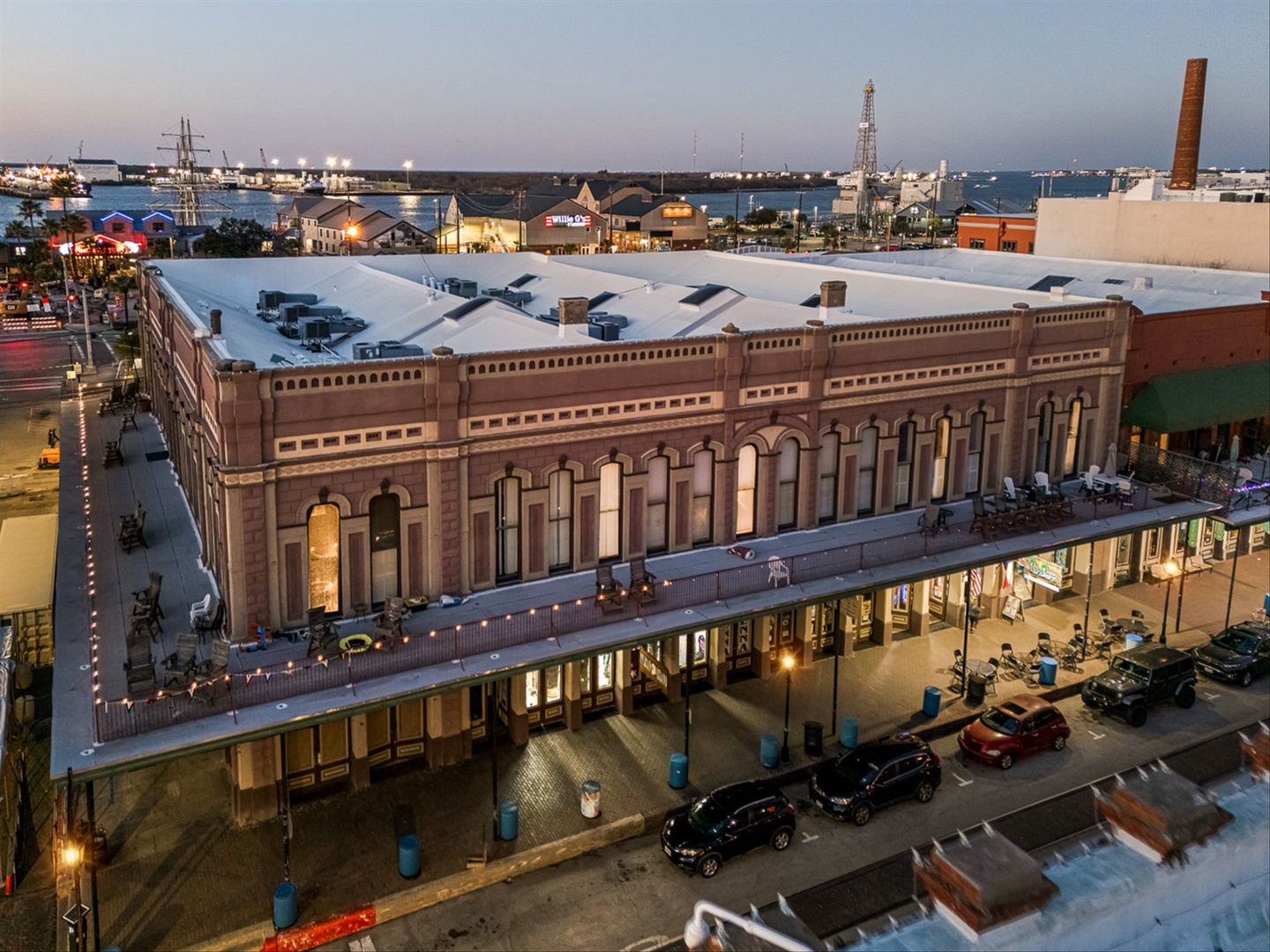 Aerial view of historic brick building in waterfront district.