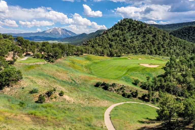 Play a relaxing round on beautifully manicured greens surrounded by mountain views.