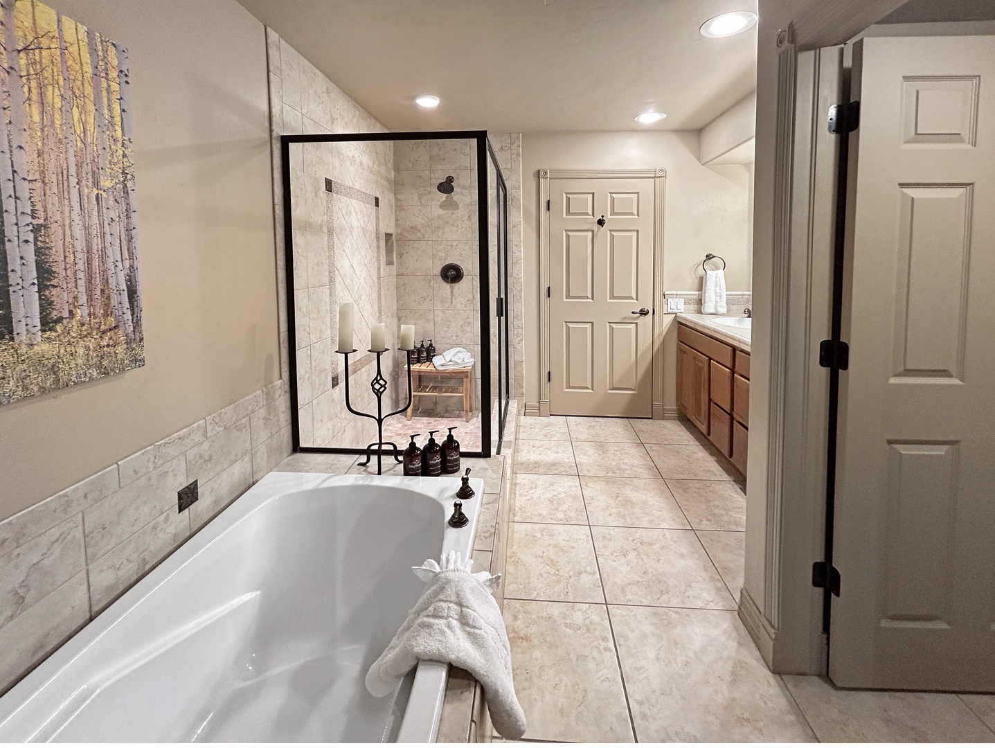 Your private spa retreat awaits with a luxurious soaking tub and elegant walk-in shower, perfect for unwinding after your adventures.