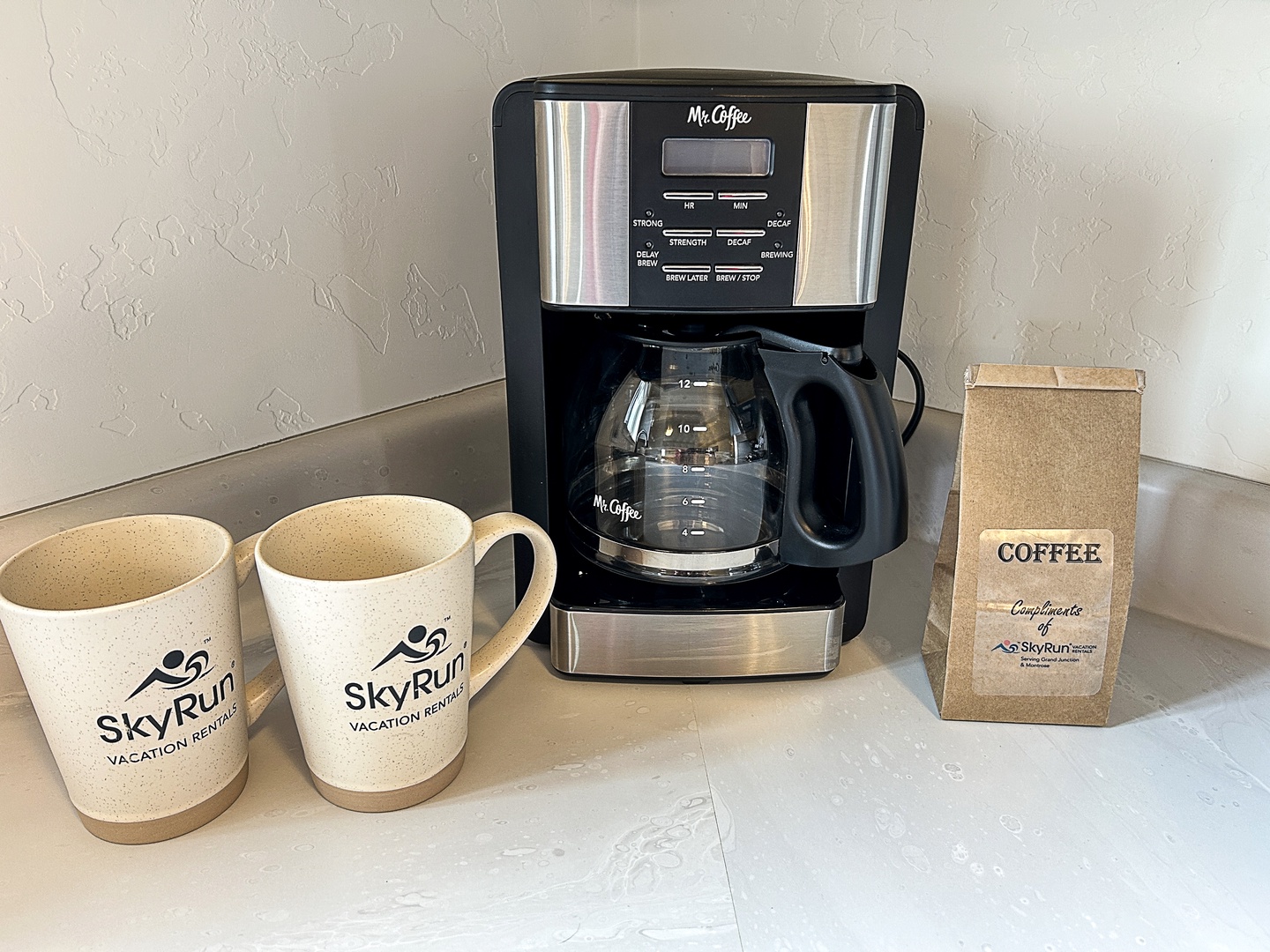Drip coffee maker with coffee available for guests