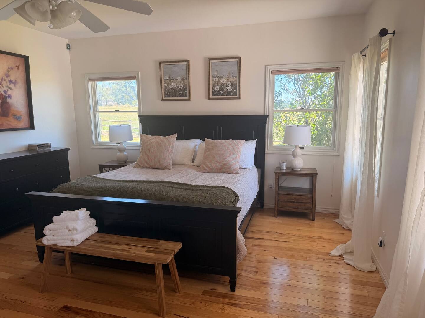 Wake to peaceful countryside views and soft natural light - crisp linens, warm woods, and gentle breezes await.