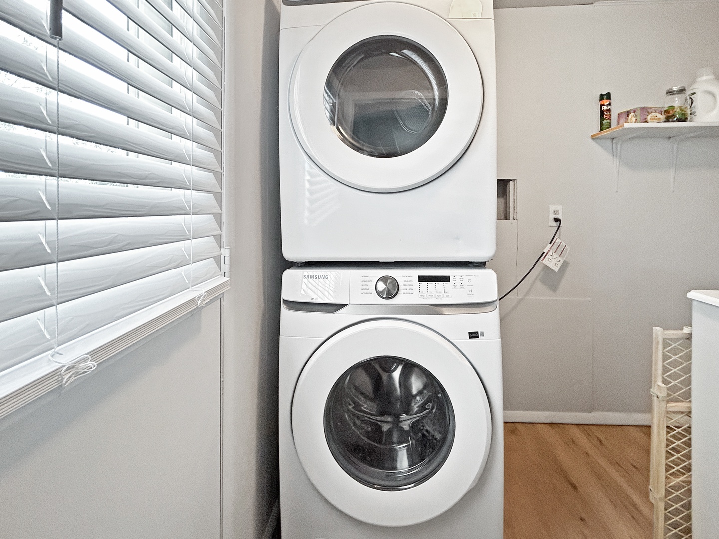 Enjoy the convenience of an in-unit laundry room with a stacked washer and dryer.