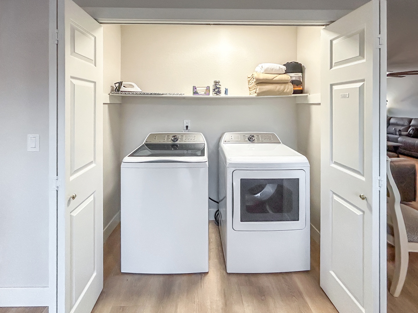 Keep your clothes fresh with your own washer and dryer, complete with convenient shelving for all your laundry essentials.
