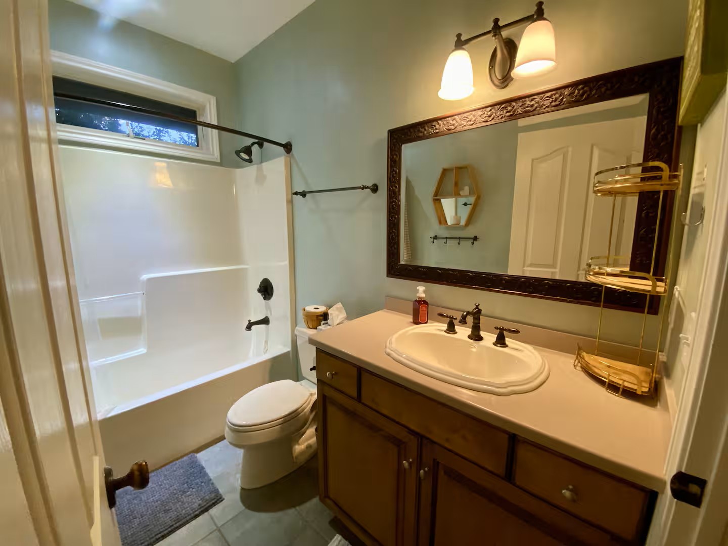 Freshen up in your private bathroom featuring a full tub-shower combo, perfectly appointed for your comfort and convenience.