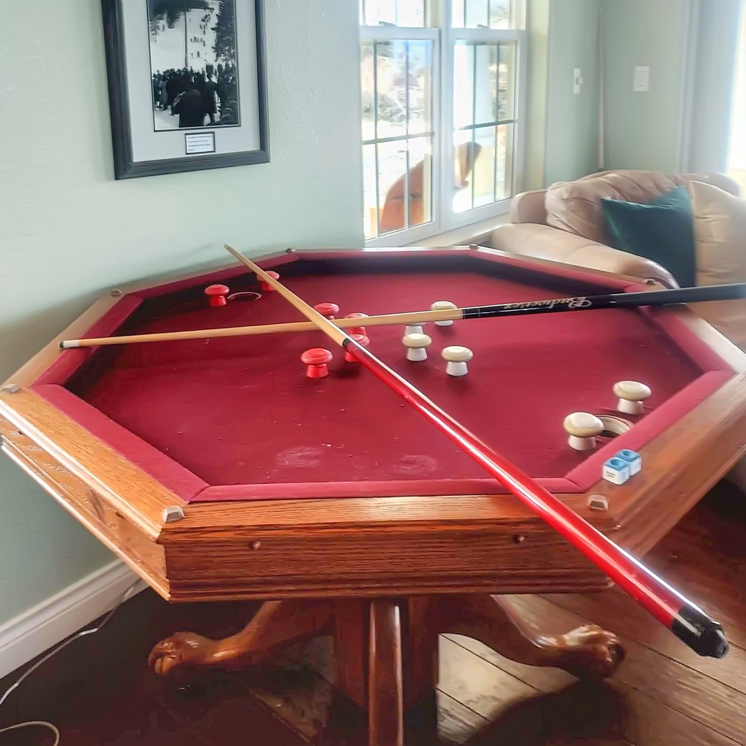 Challenge friends to a game on the bumper pool table.
