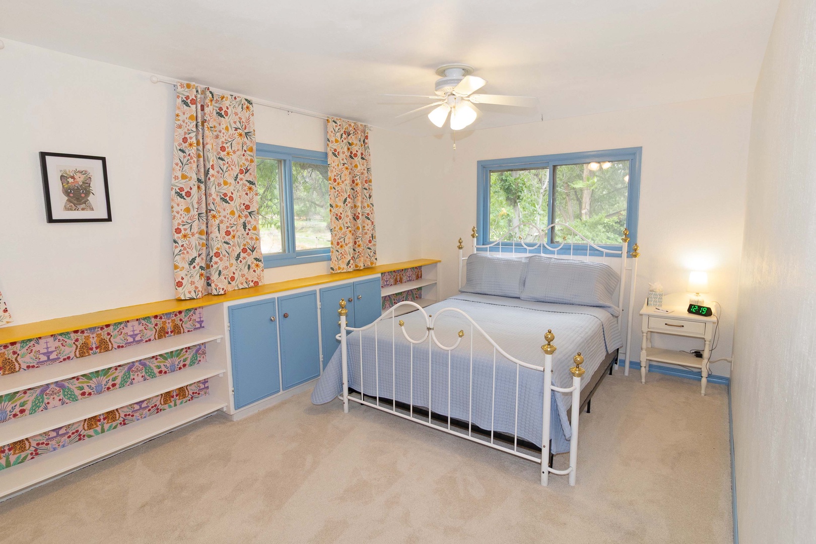 Step into your charming bedroom with cheerful pops of color and natural light streaming through dual windows.