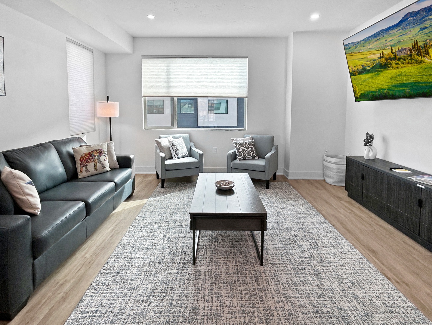 Spacious living room with huge smart tv.