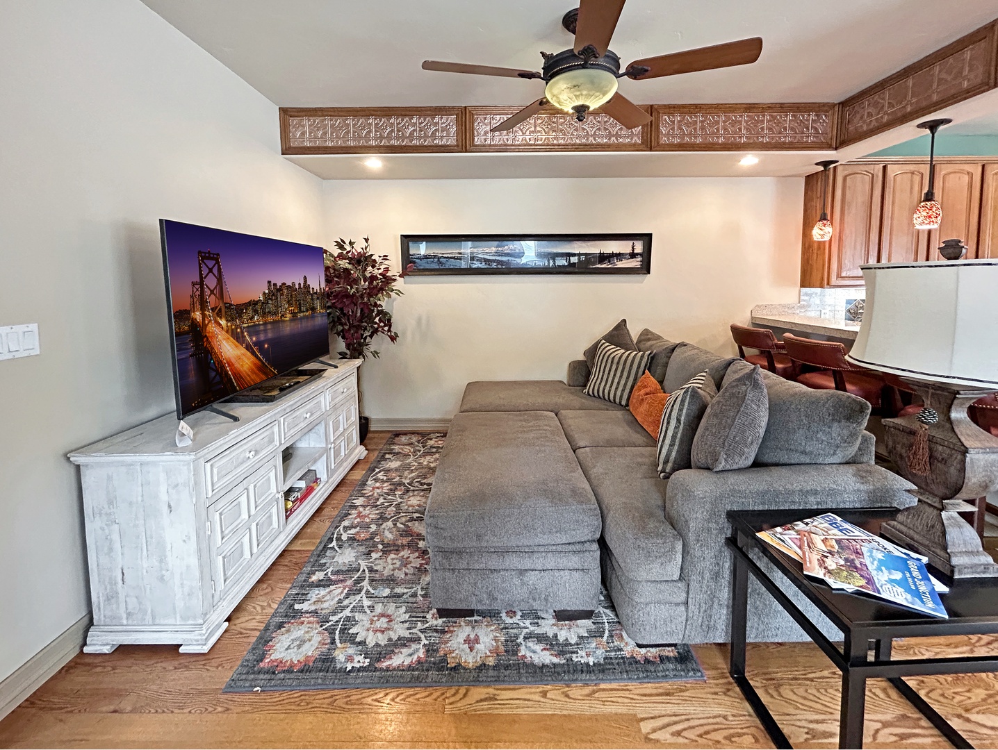 Unwind in your spacious living area with plush sectional seating, large flat-screen smart TV.