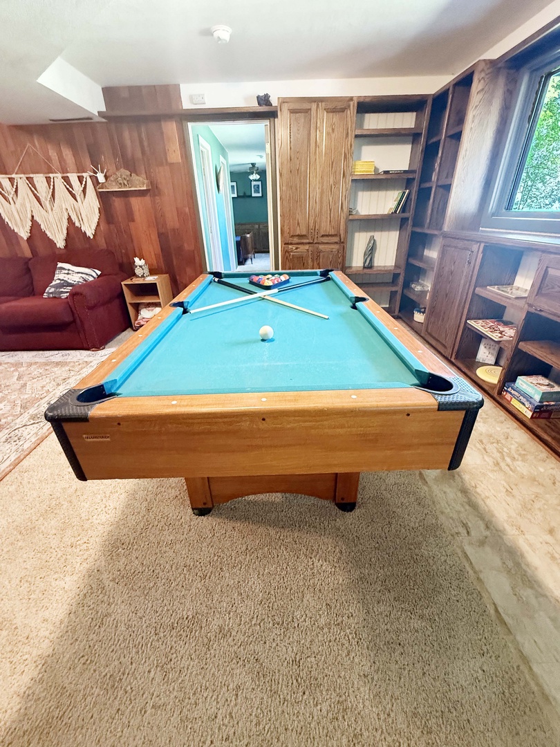 Challenge your friends to a friendly game in this cozy billiards room.
