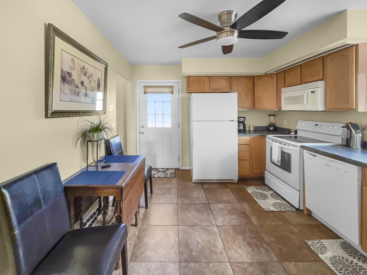 Full kitchen with tile flooring