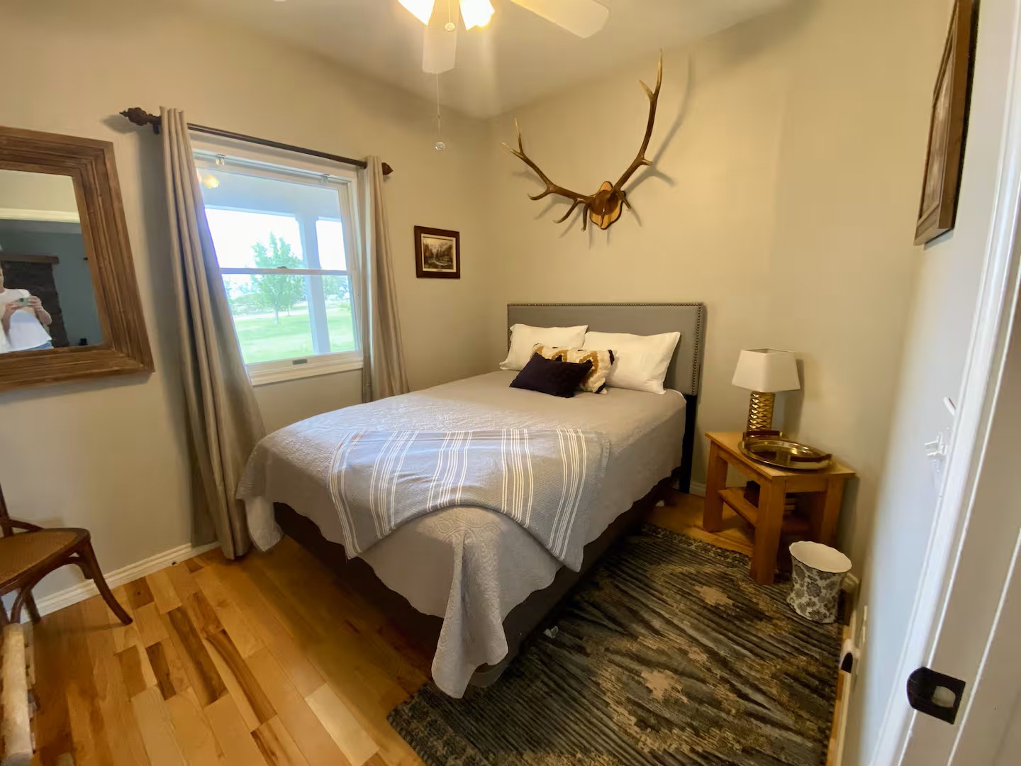 Drift off in this cozy bedroom with a queen bed, where rustic charm meets comfort.