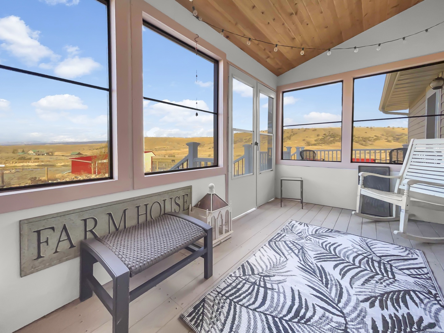 Relax on the enclosed porch with awesome views