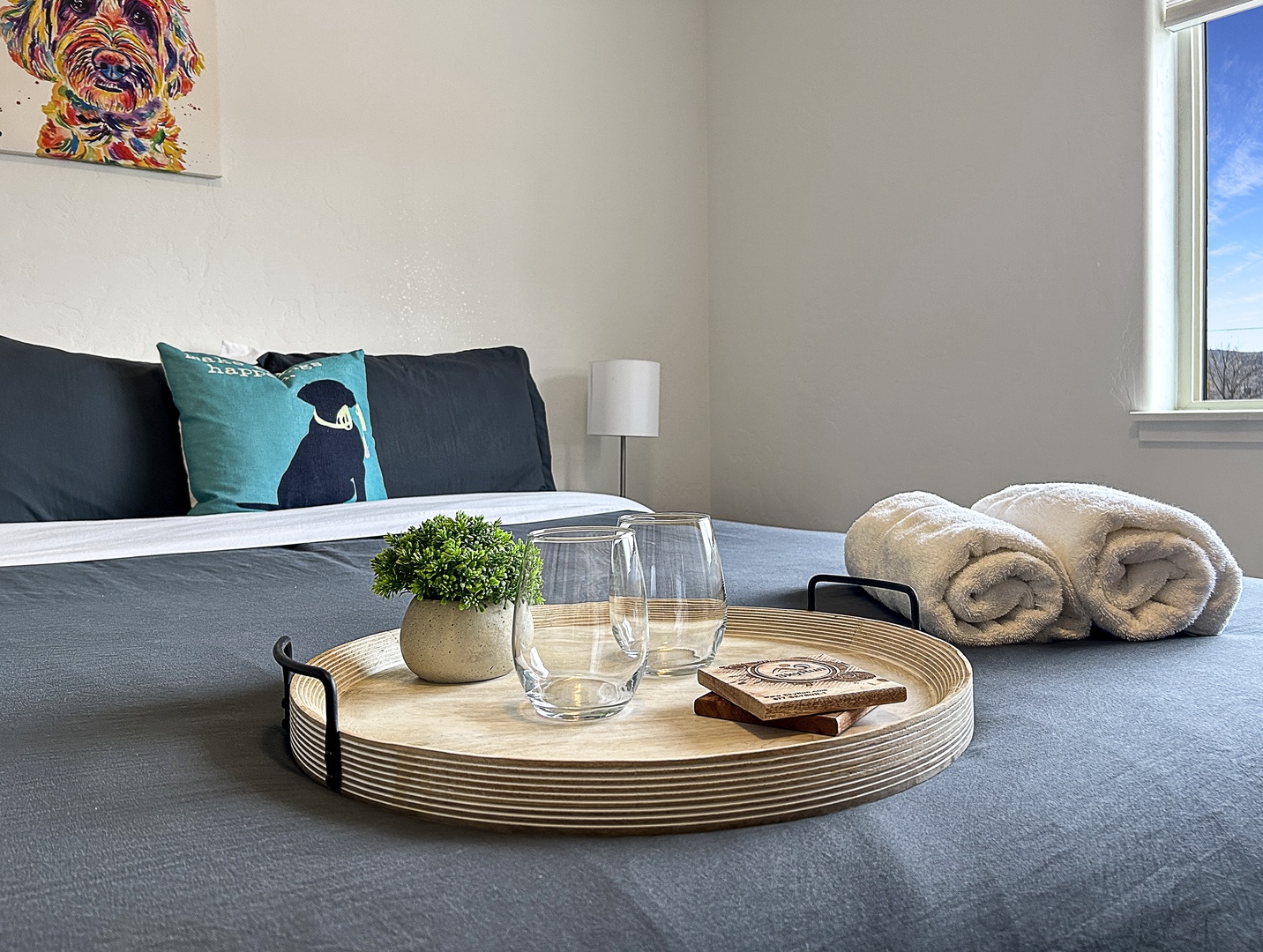 Unwind in your thoughtfully appointed bedroom with plush towels, fresh flowers, and modern touches creating the perfect retreat.