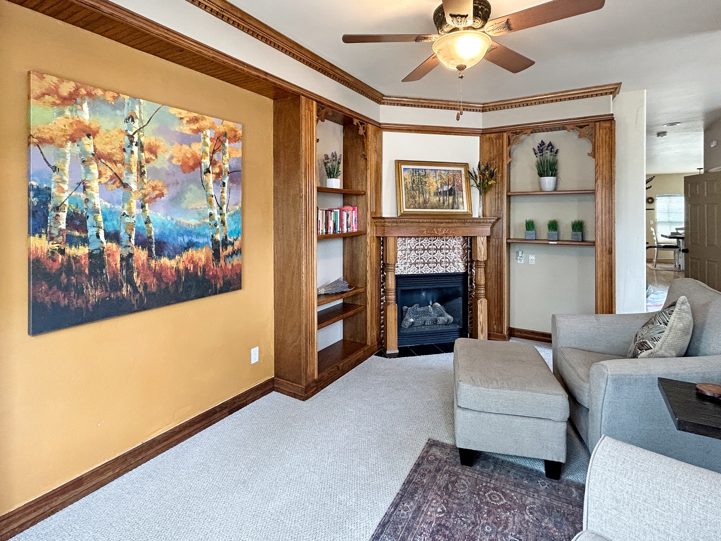 Curl up on plush chair and enjoy the gas fireplace.